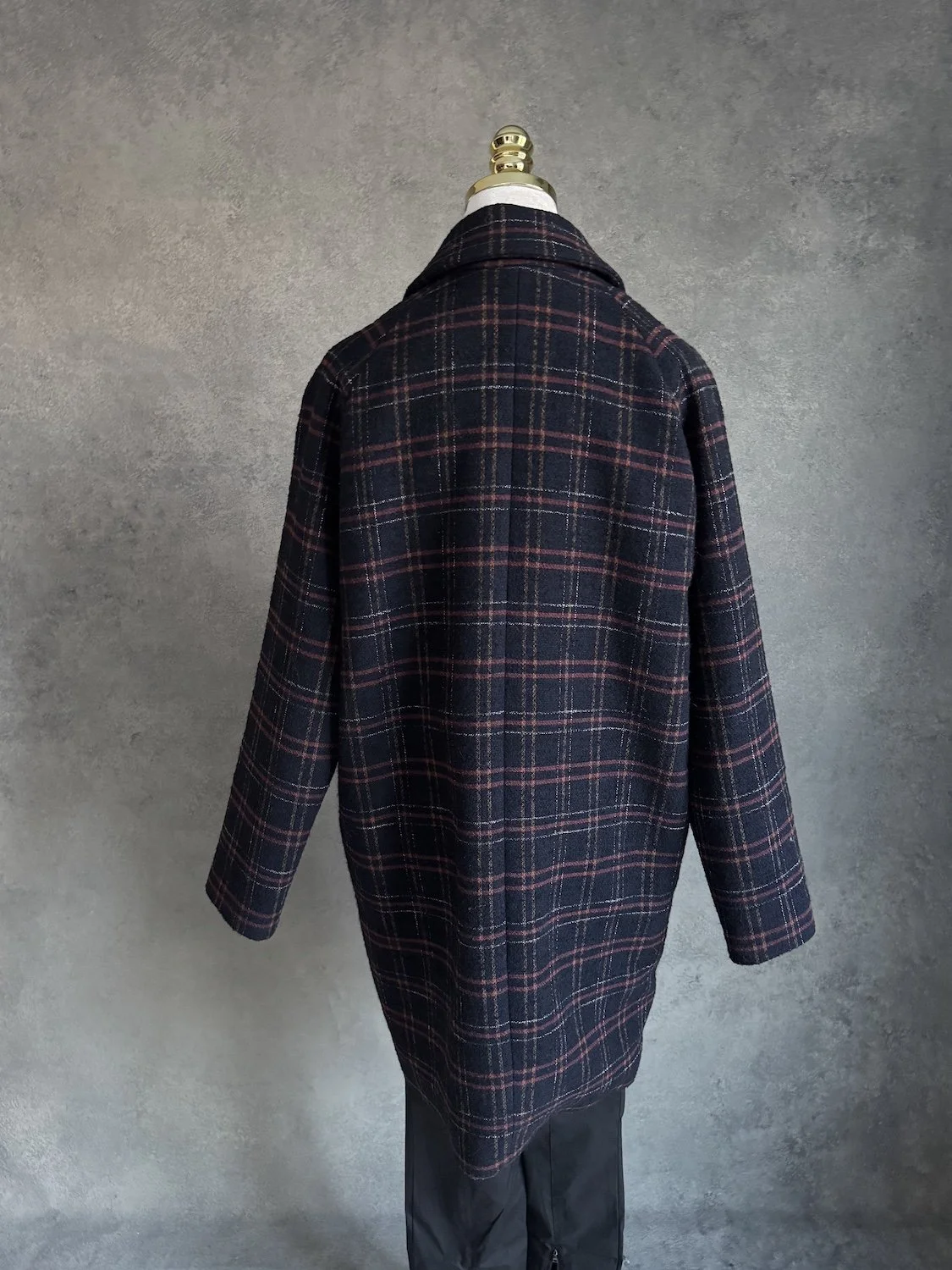 Back view of the straight-cut oversized wool-blend coat.