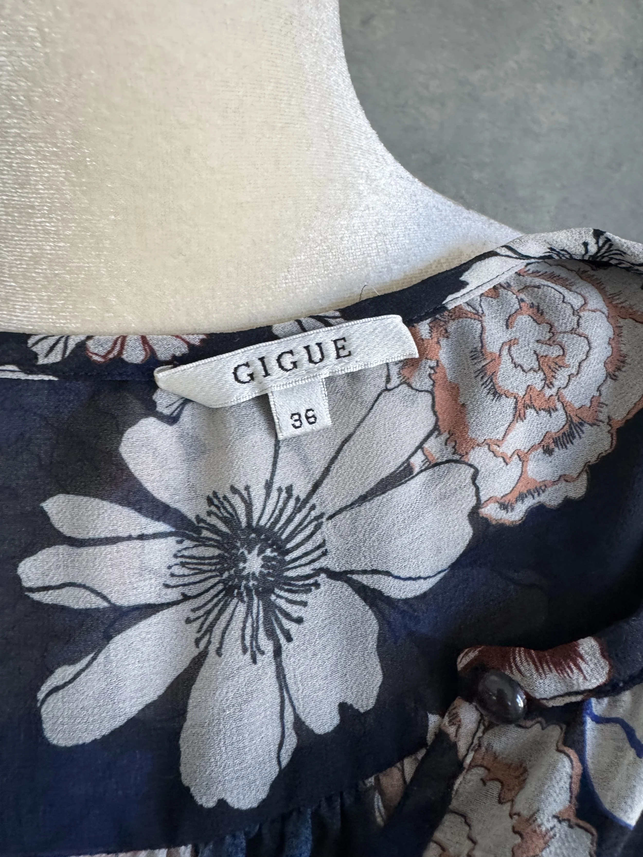 View of the Gigue brand label, confirming the authenticity and high-end construction of the garment