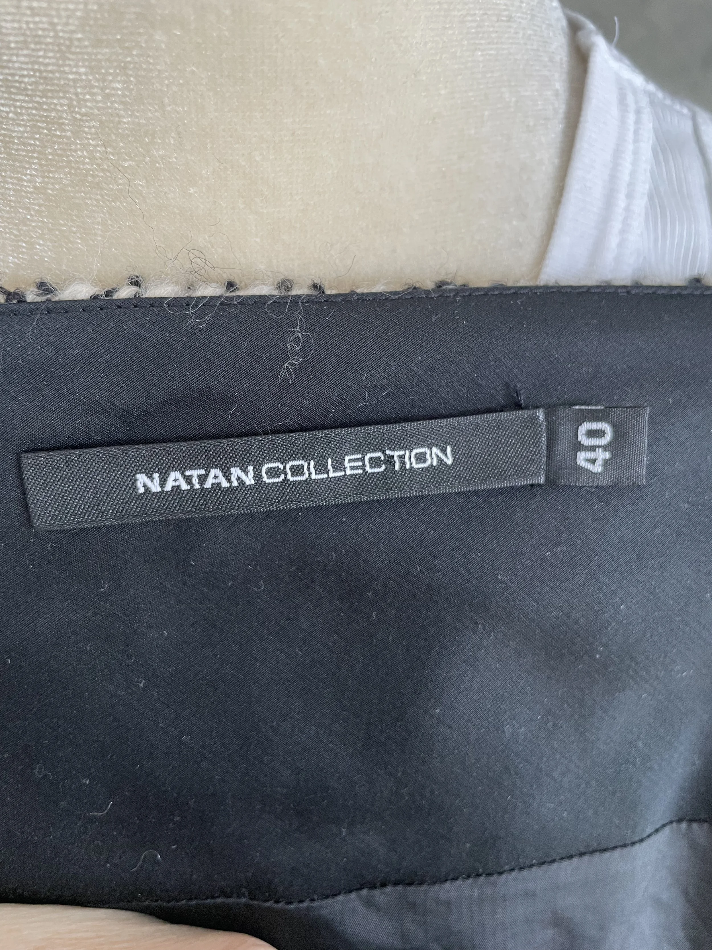 Close-up of Natan brand label and size tag (40).