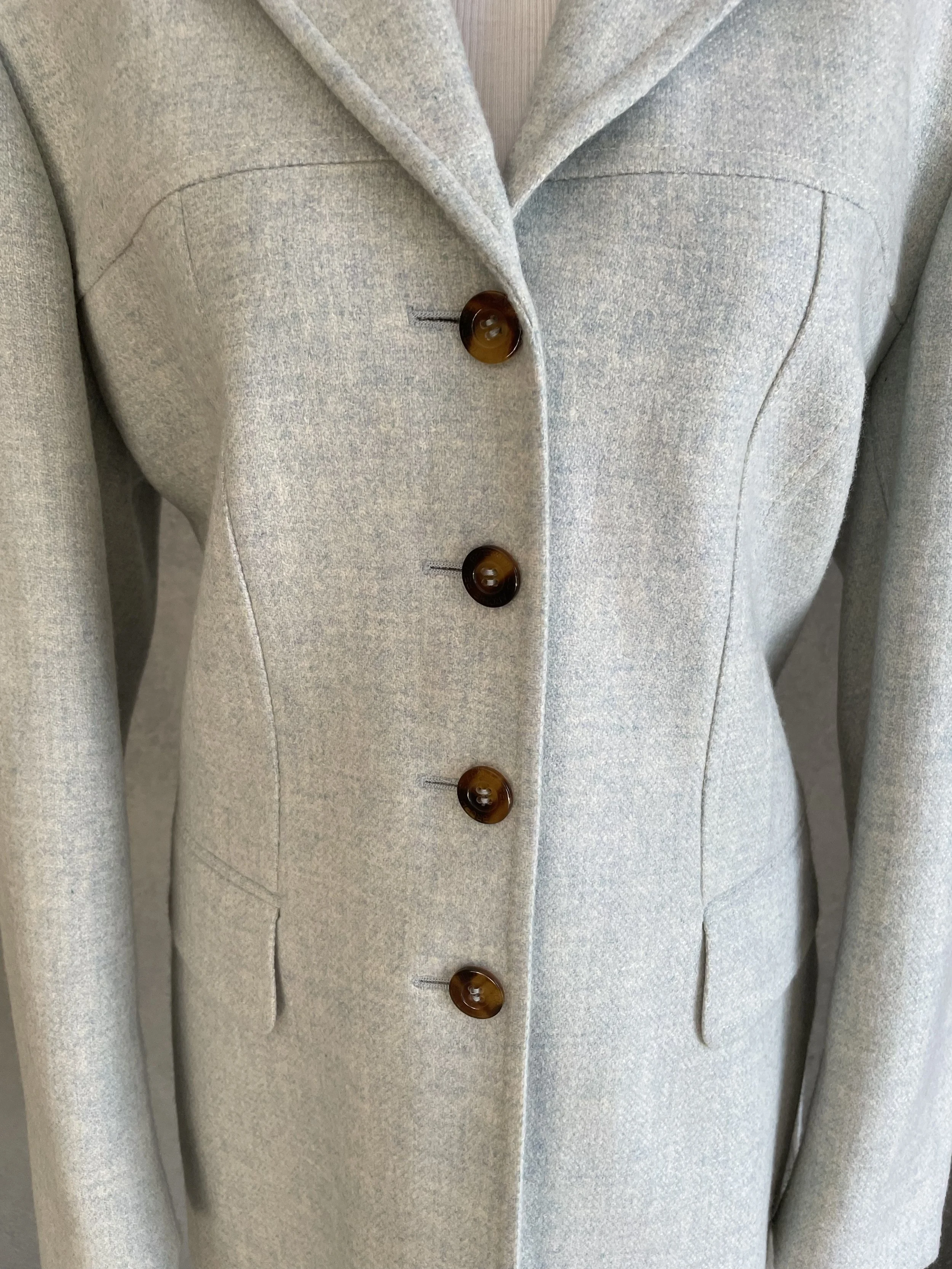 Close-up of the front buttons in horn-look finish on the Archie Pell blazer.