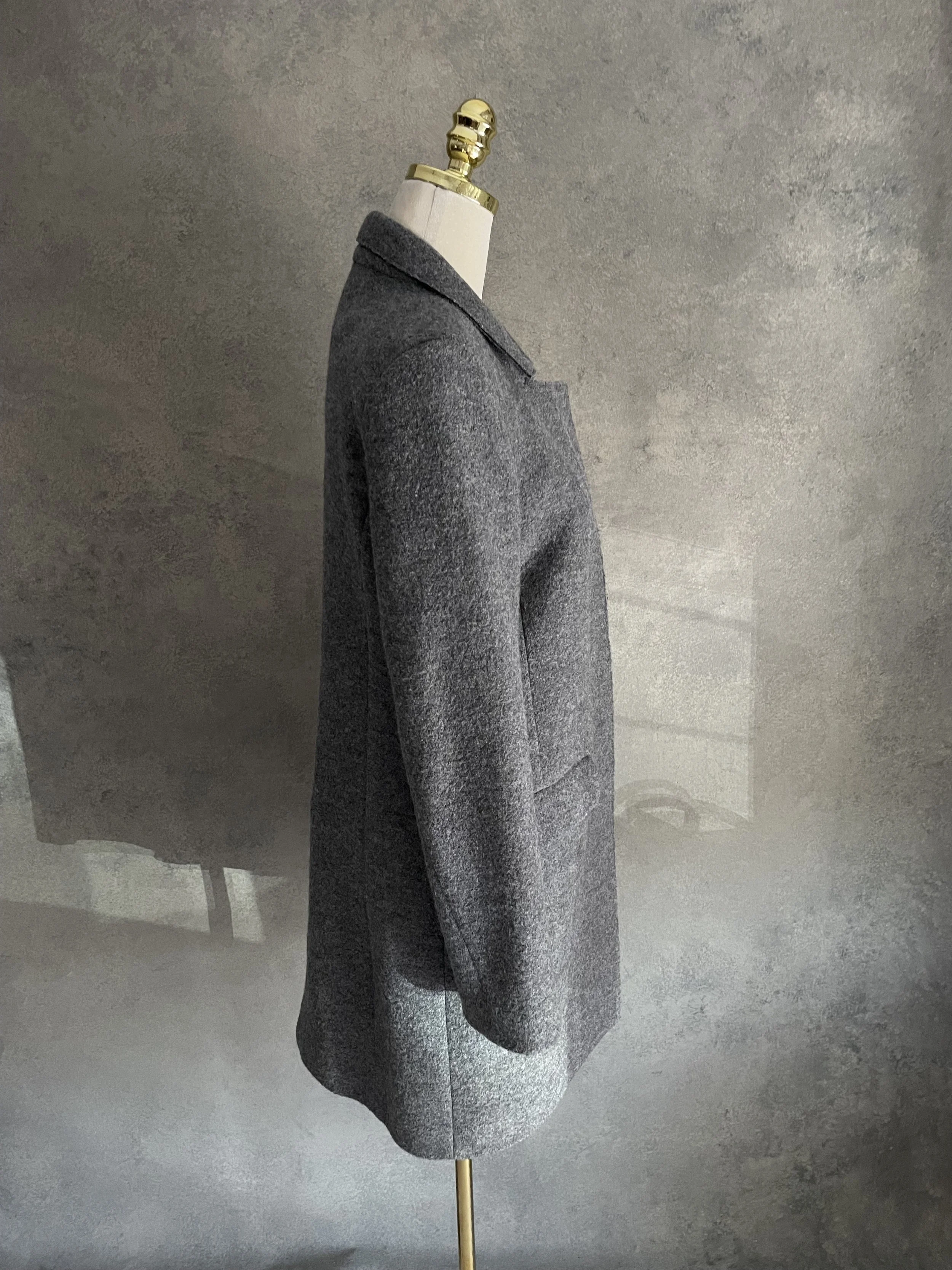 Side profile view of the Closed grey wool coat, showing the tailored fit and length on a mannequin