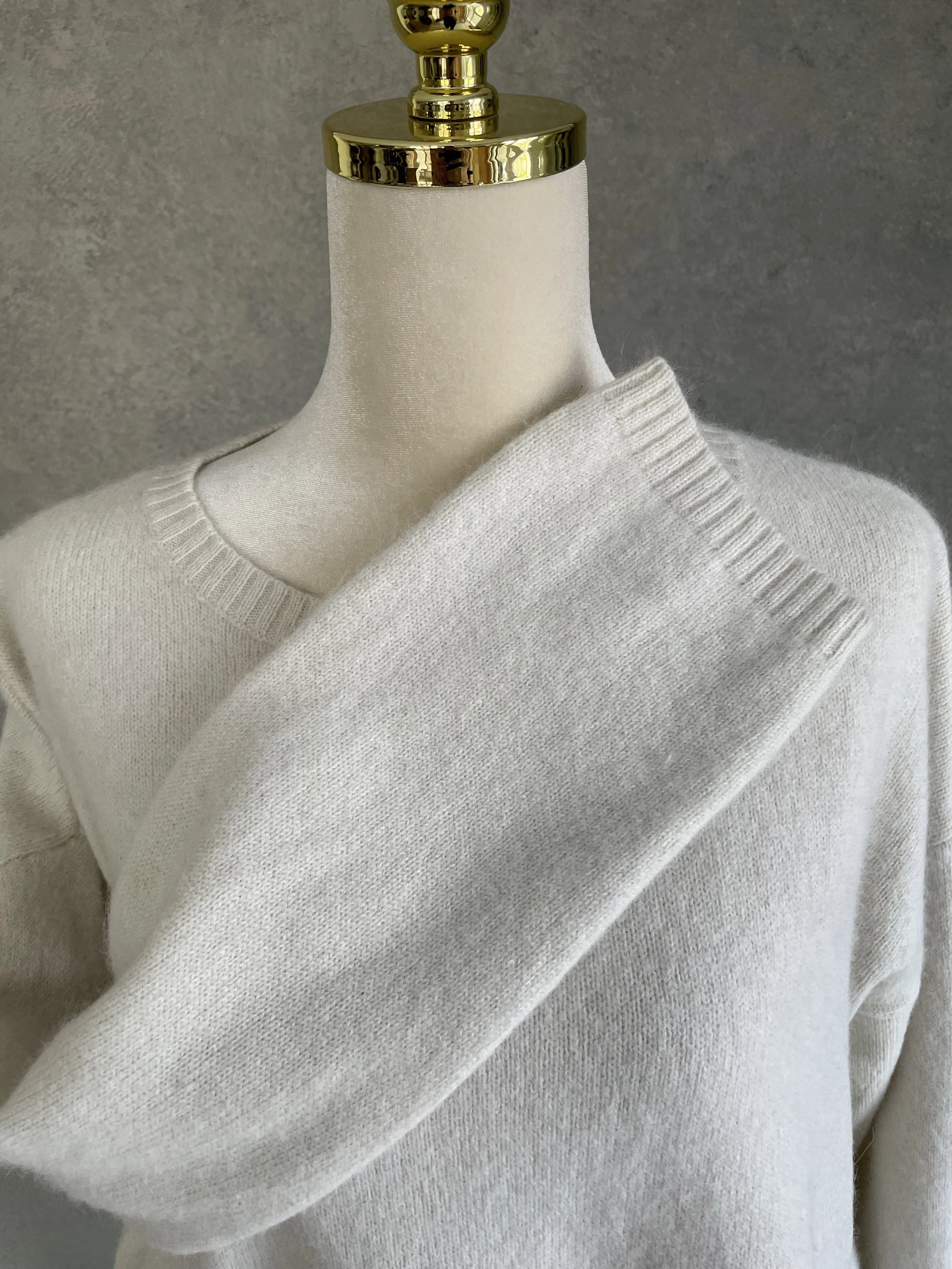 Close-up of the sleeve and shoulder detail of the Rue Blanche sweater, showing the soft angora-blend fabric.