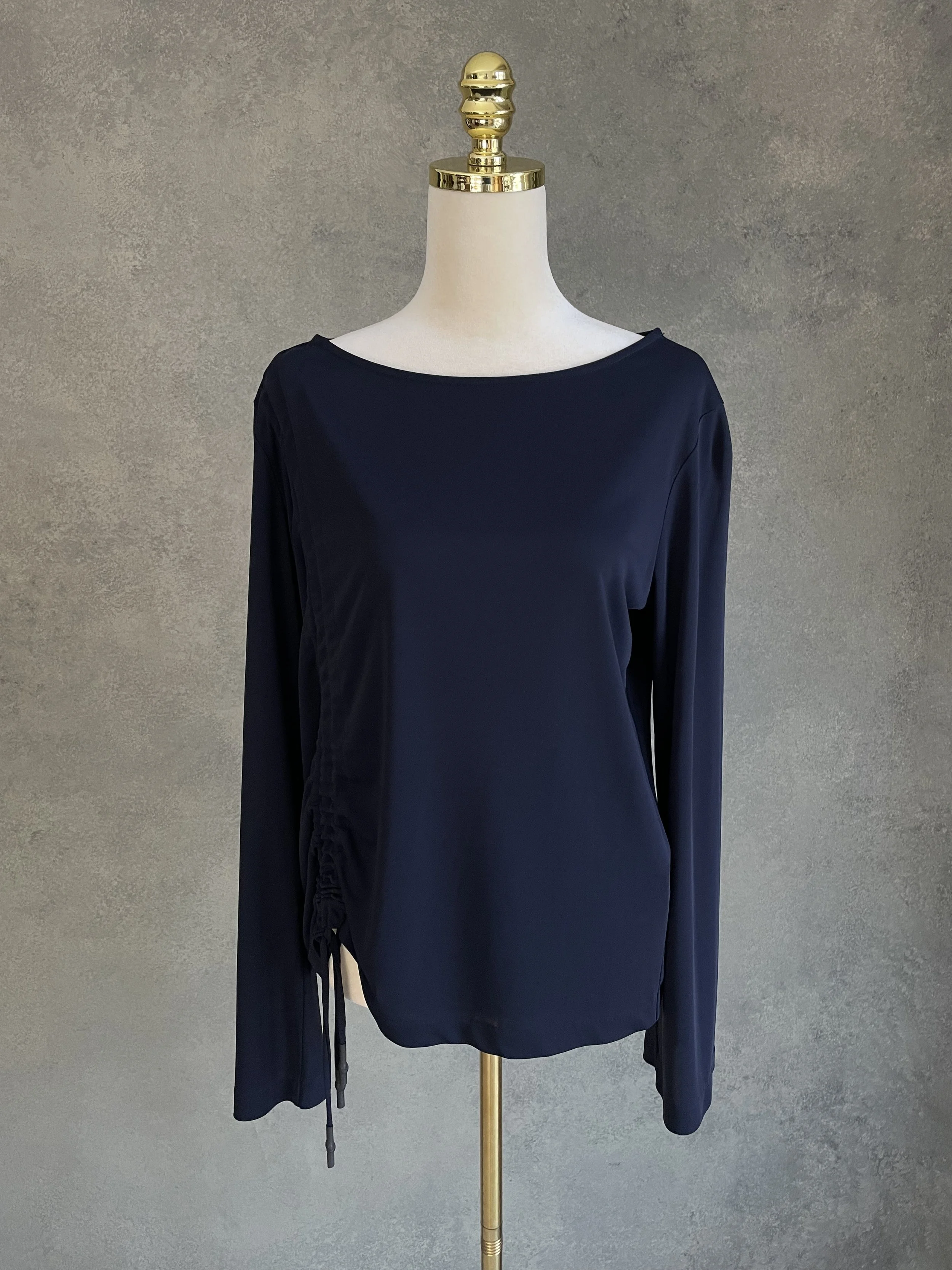 Front view of the BLANCHE navy top, showcasing the elegant boat-neck style.