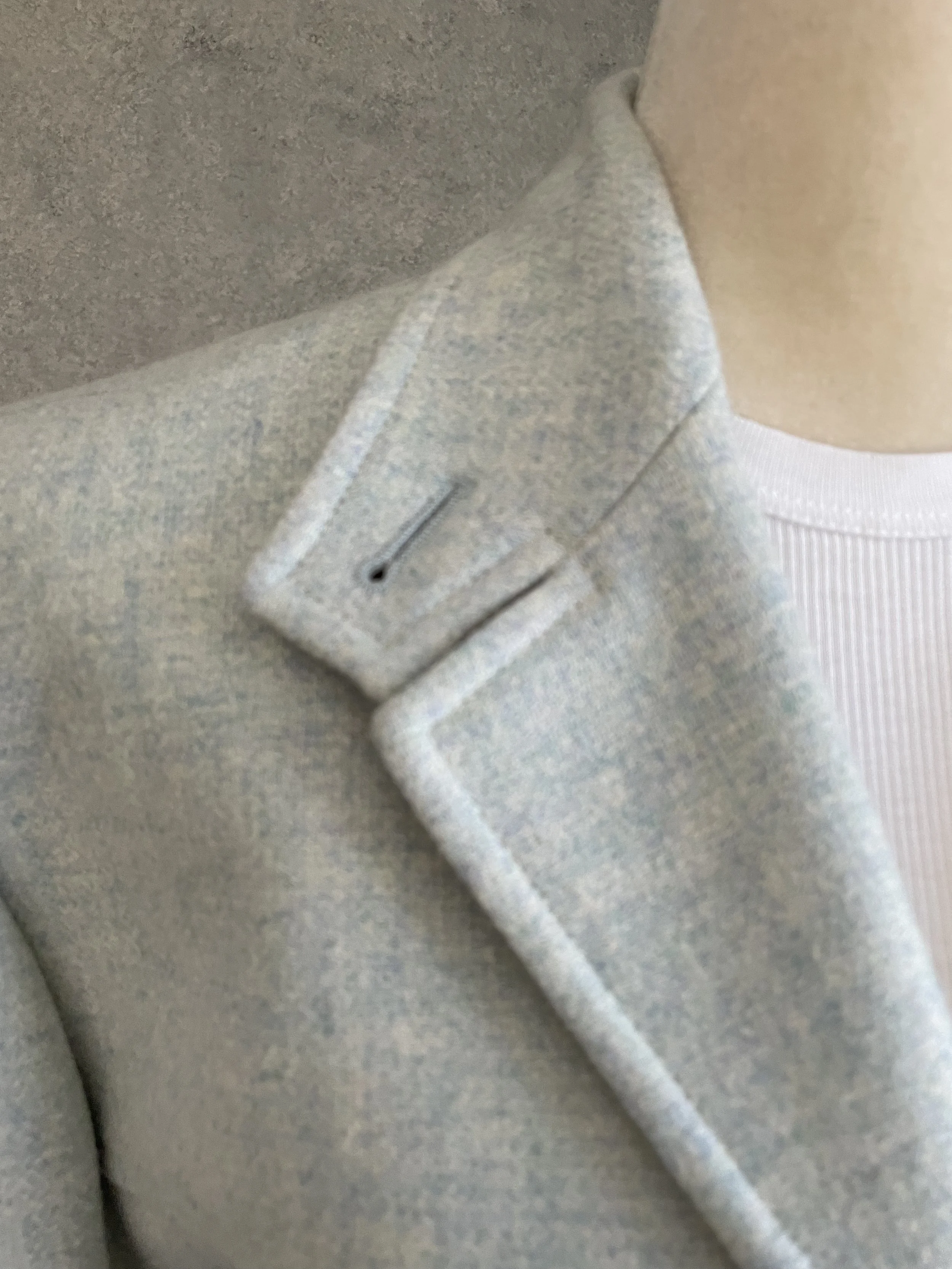 Close-up of the classic lapel and collar stitching on the Archie Pell blazer.
