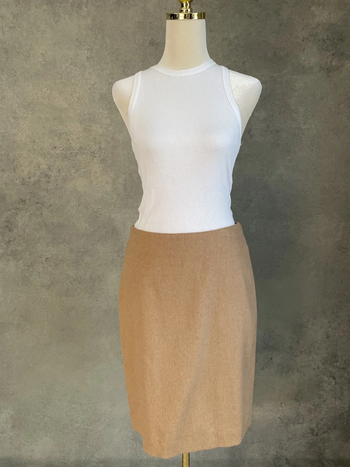 Max Mara classic camel 100% camelhair pencil skirt front view on mannequin with white ribbed top