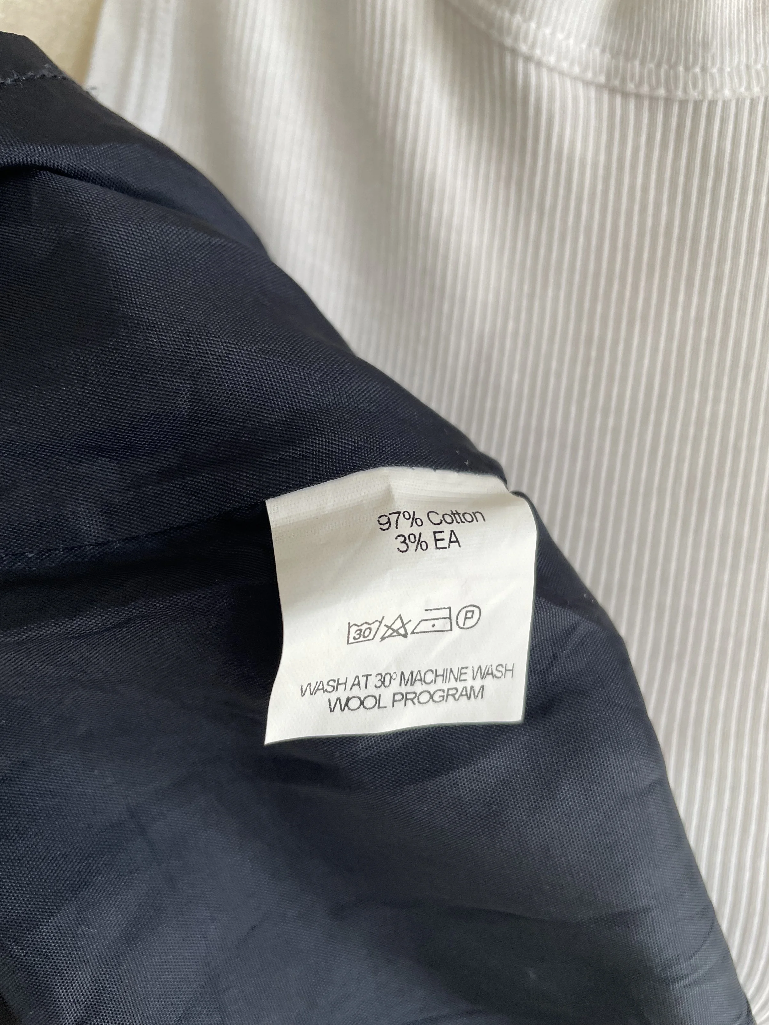 Interior label showing material composition (97% cotton, 3% elastane).