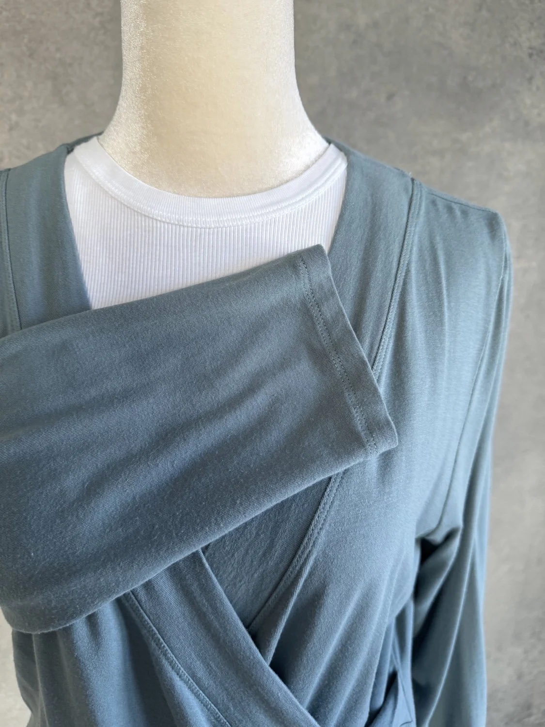 Ralph Lauren aqua blue wrap jersey sleeve and neckline texture close-up