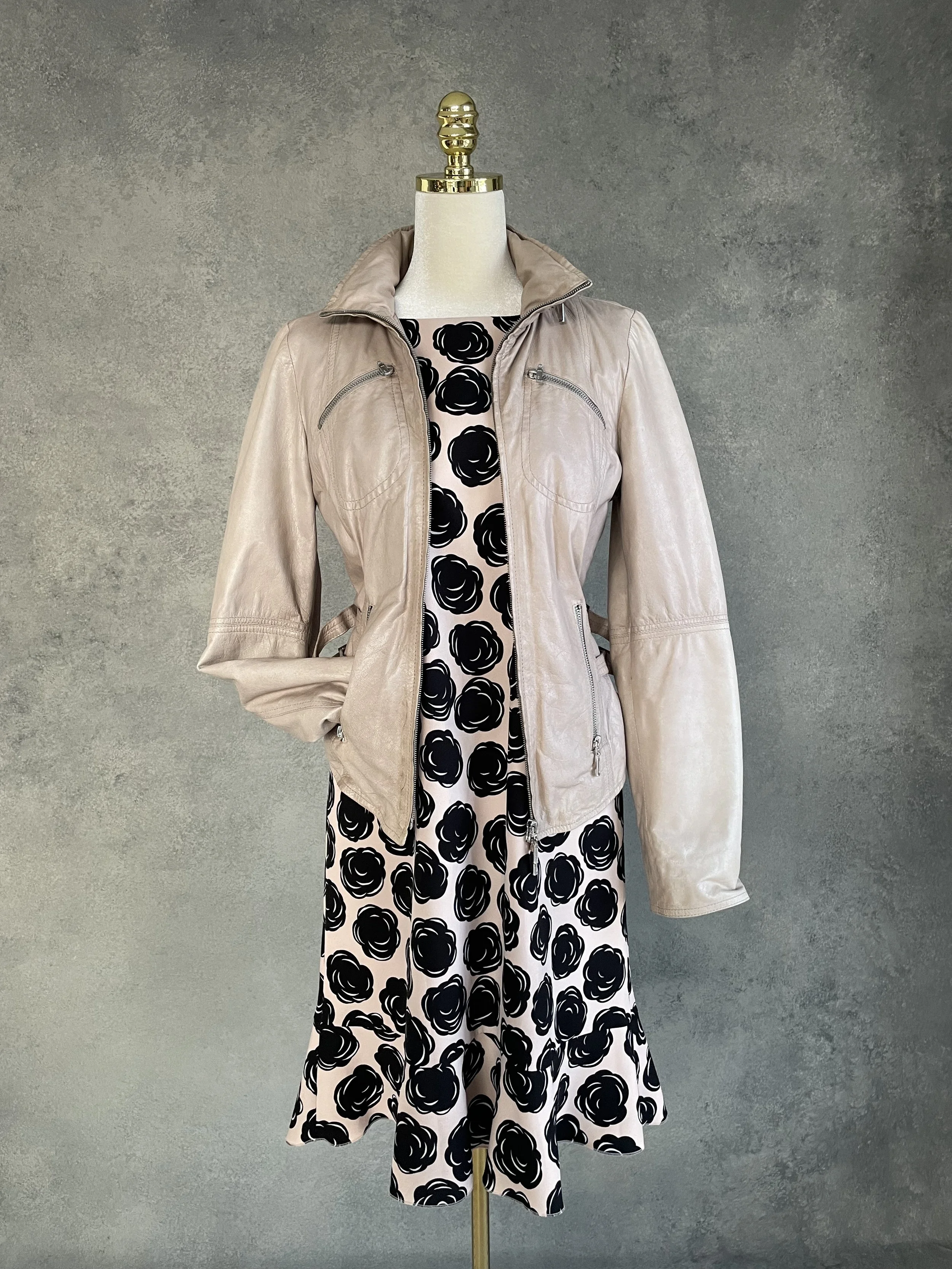 Gigue black and nude floral dress layered with a structured blazer on a mannequin, demonstrating a chic, professional capsule wardrobe aesthetic."