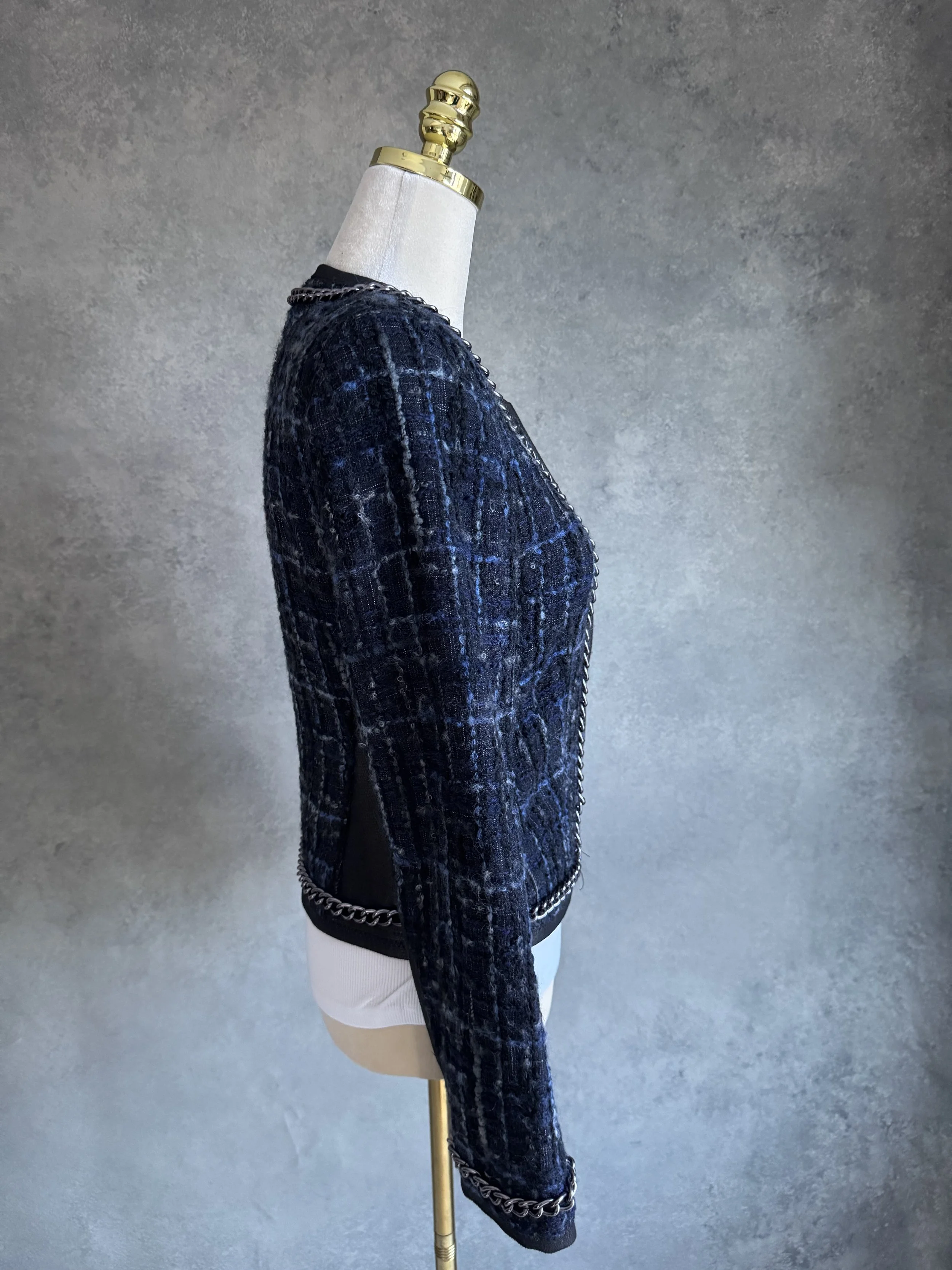 Side profile view of the Riani tweed blazer, showcasing the slim fit and leather-look trim.