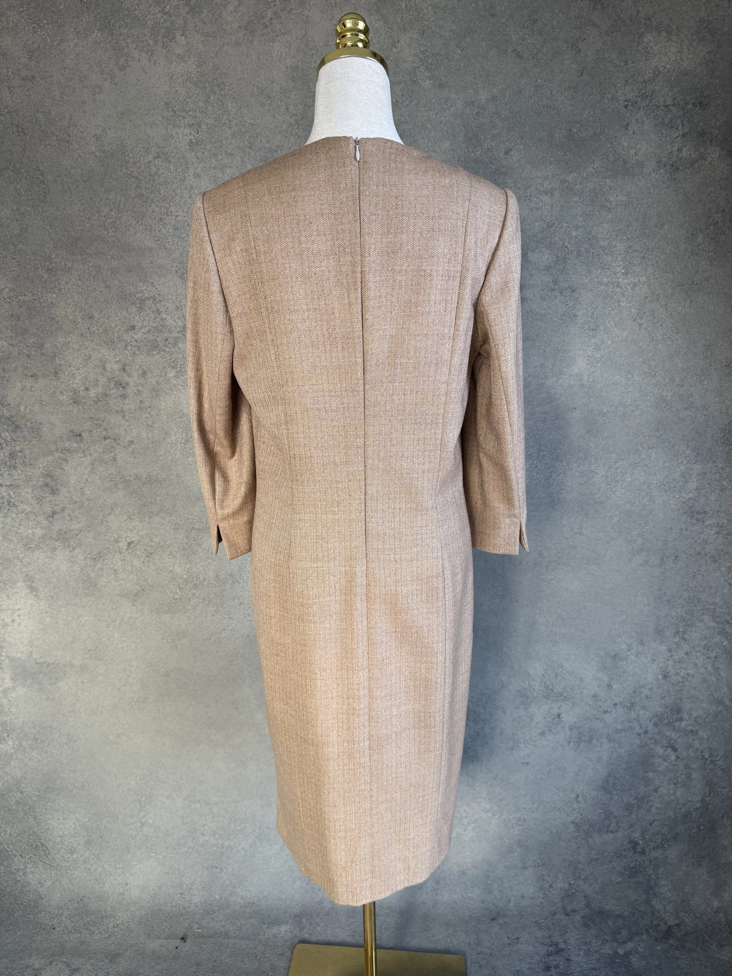 Detailed close-up of the back zipper closure at the neckline of the vintage wool dress.