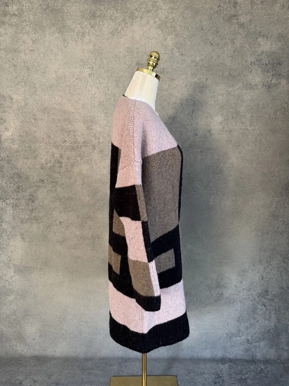 Side profile view of La Fée Maraboutee long color-block cardigan