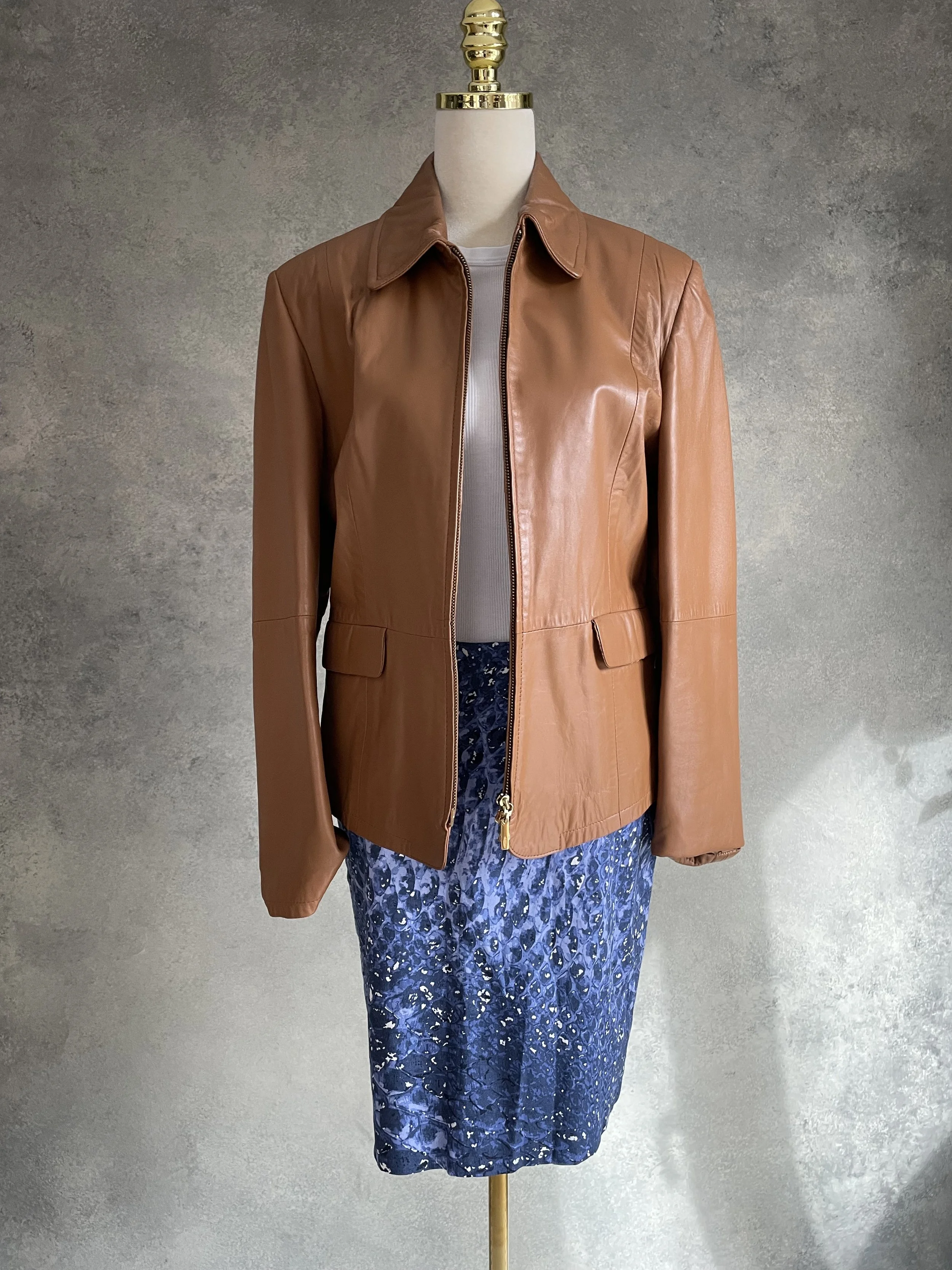 Gigue skirt paired with a brown leather jacket, showing an edgy styling option.