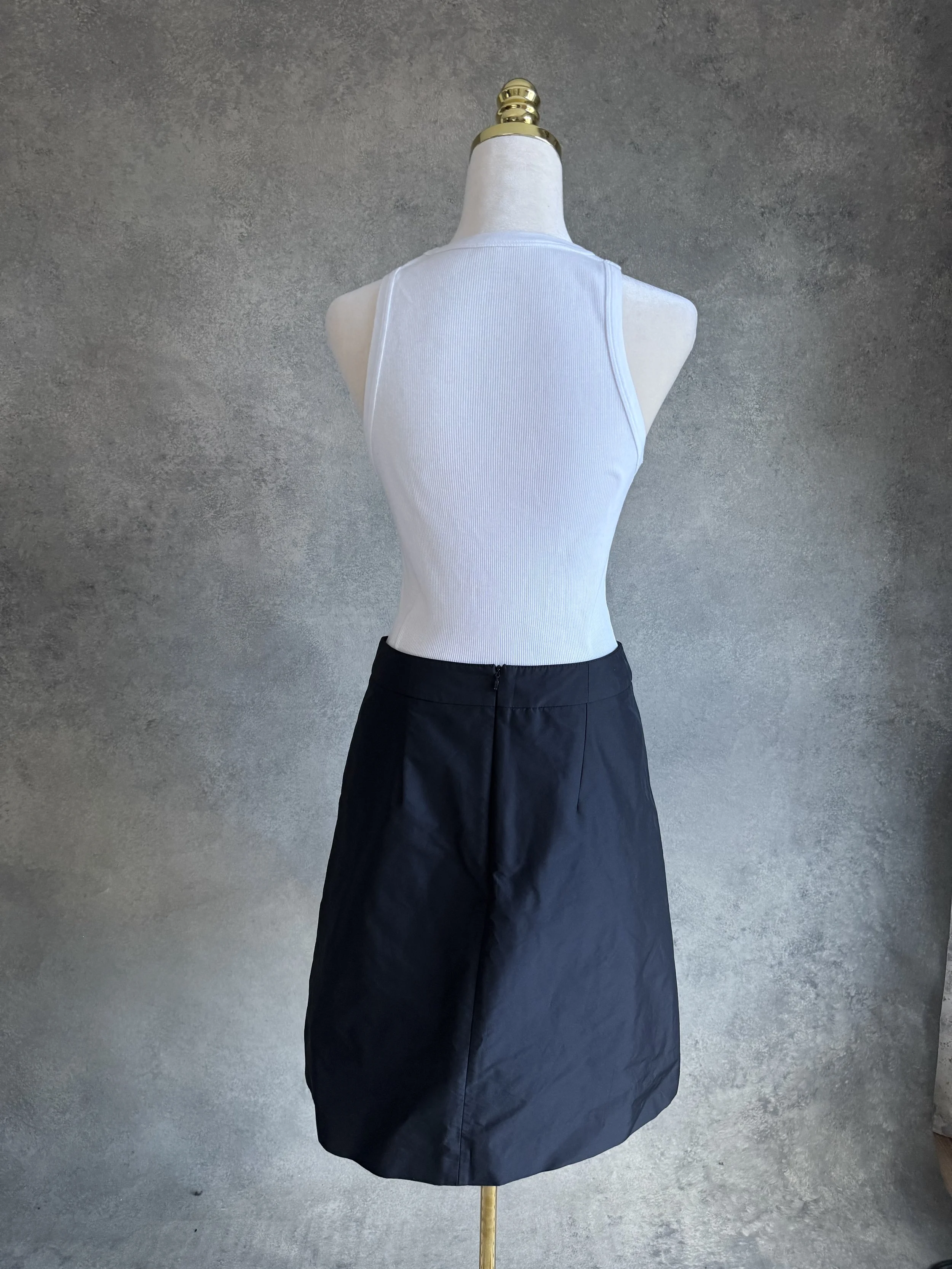 Full back view of the black HUGO skirt displayed on a mannequin."