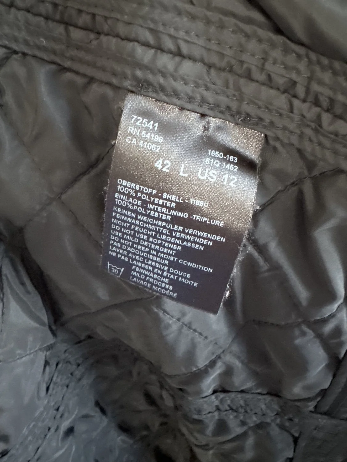 Bogner care and composition label showing size 42 L US 12 and 100% polyester