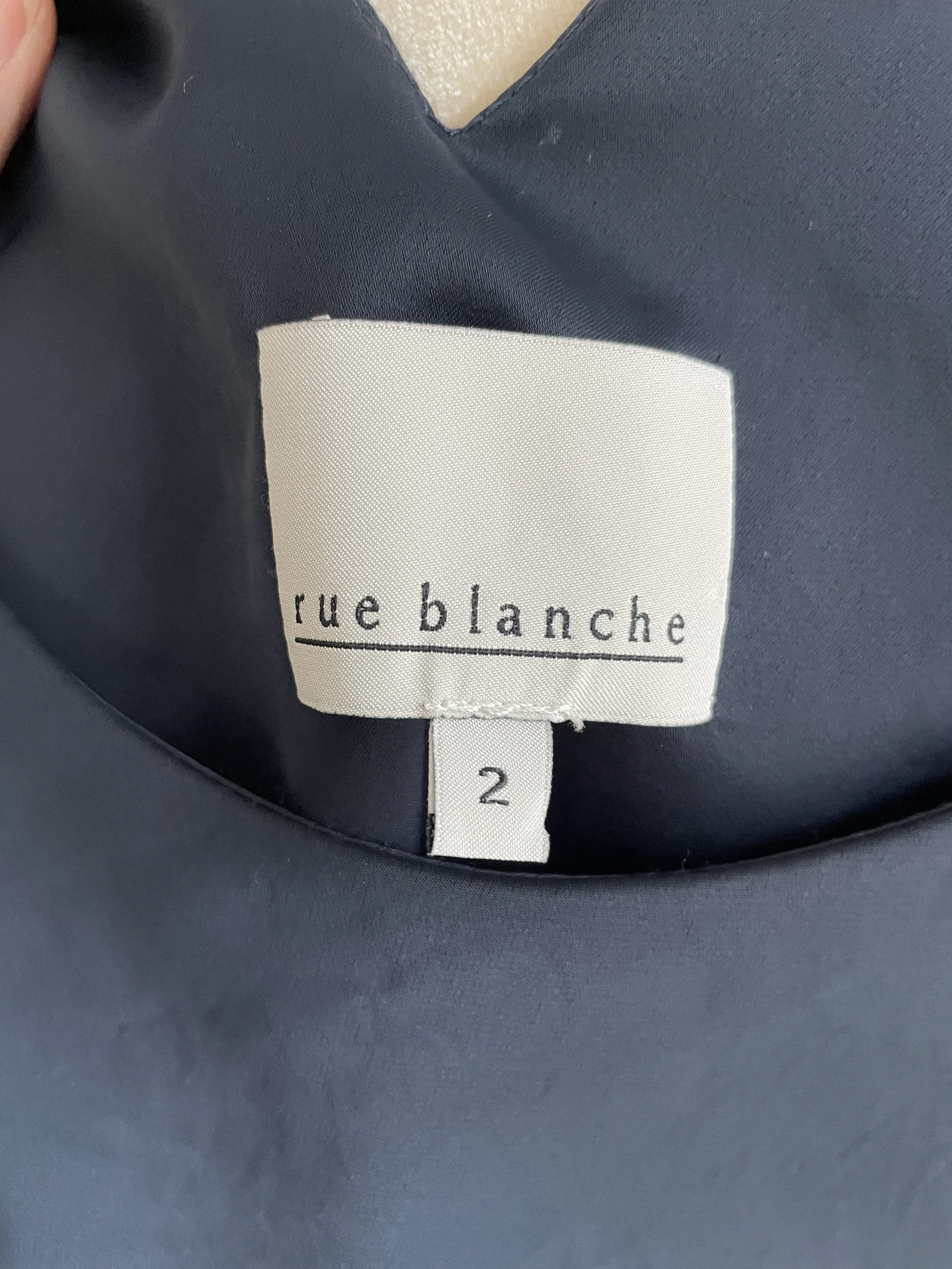 Image of the Rue Blanche brand tag, indicating size 2.