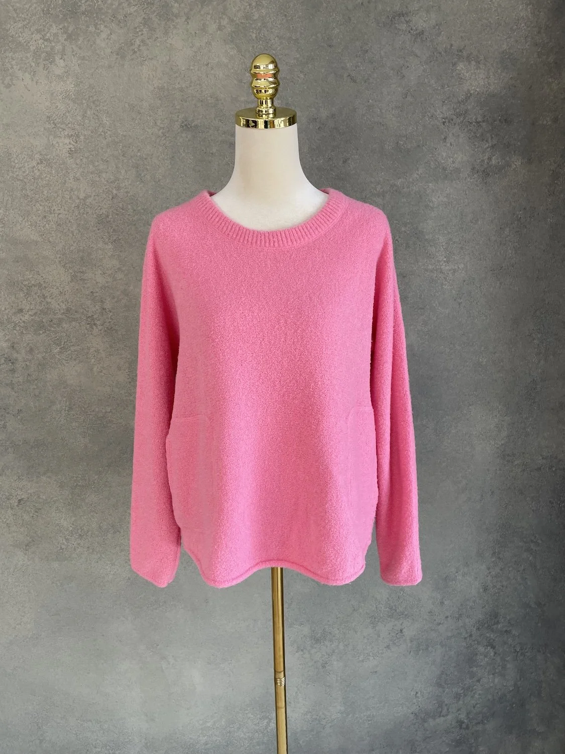 EEssentiel Antwerp pink knit sweater straight front view on mannequin