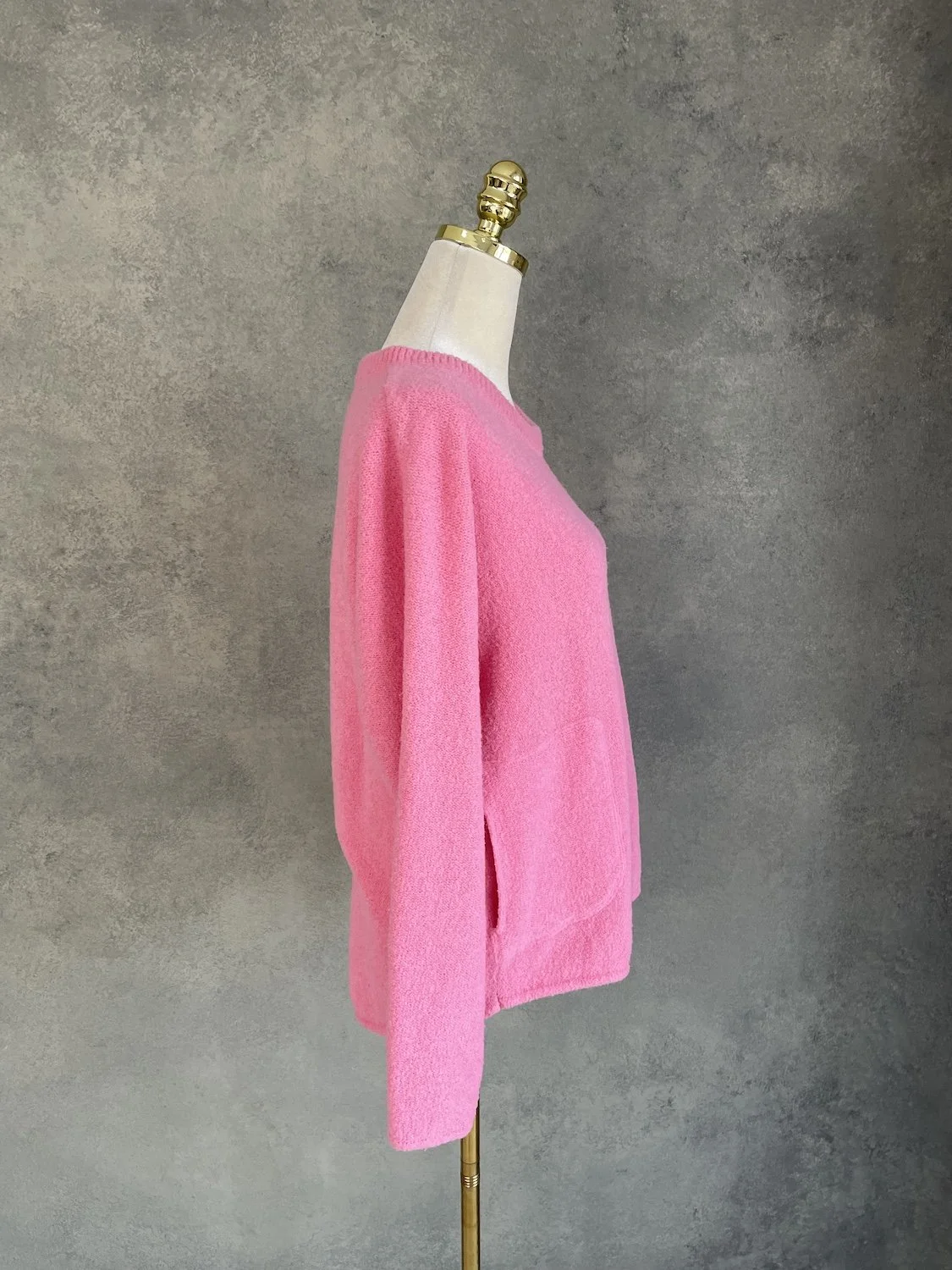 Essentiel Antwerp pink jumper side profile view showing pocket placement on mannequin