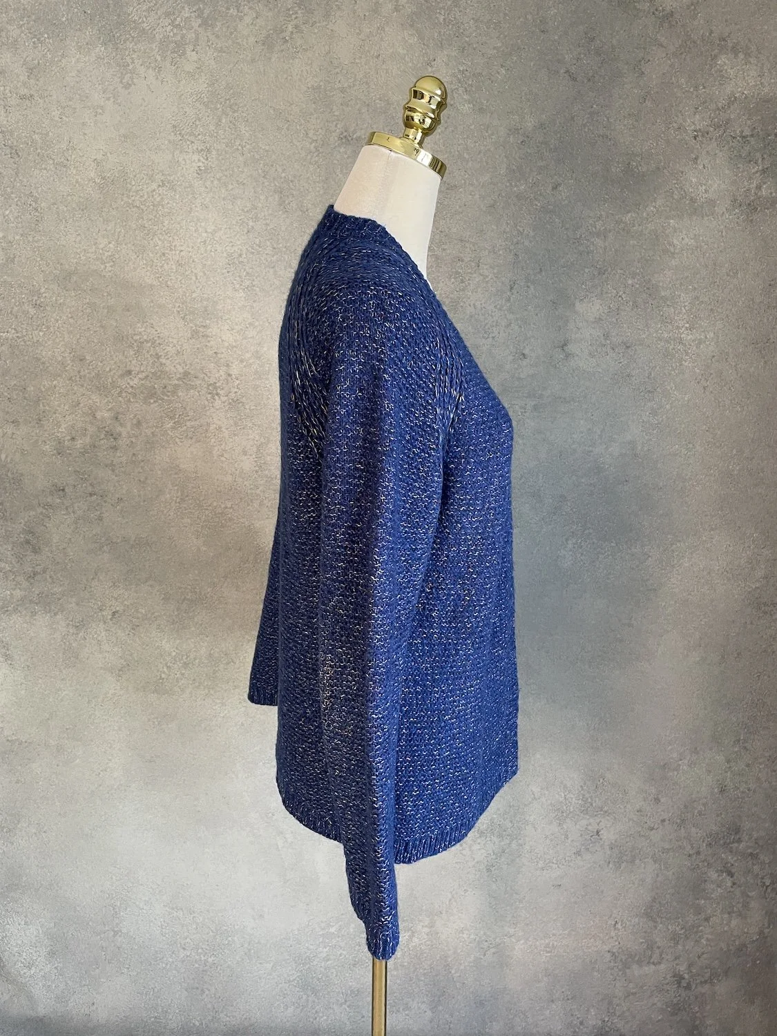 Side profile view of the Xandres open-front cardigan on a mannequin showing the length and drape.