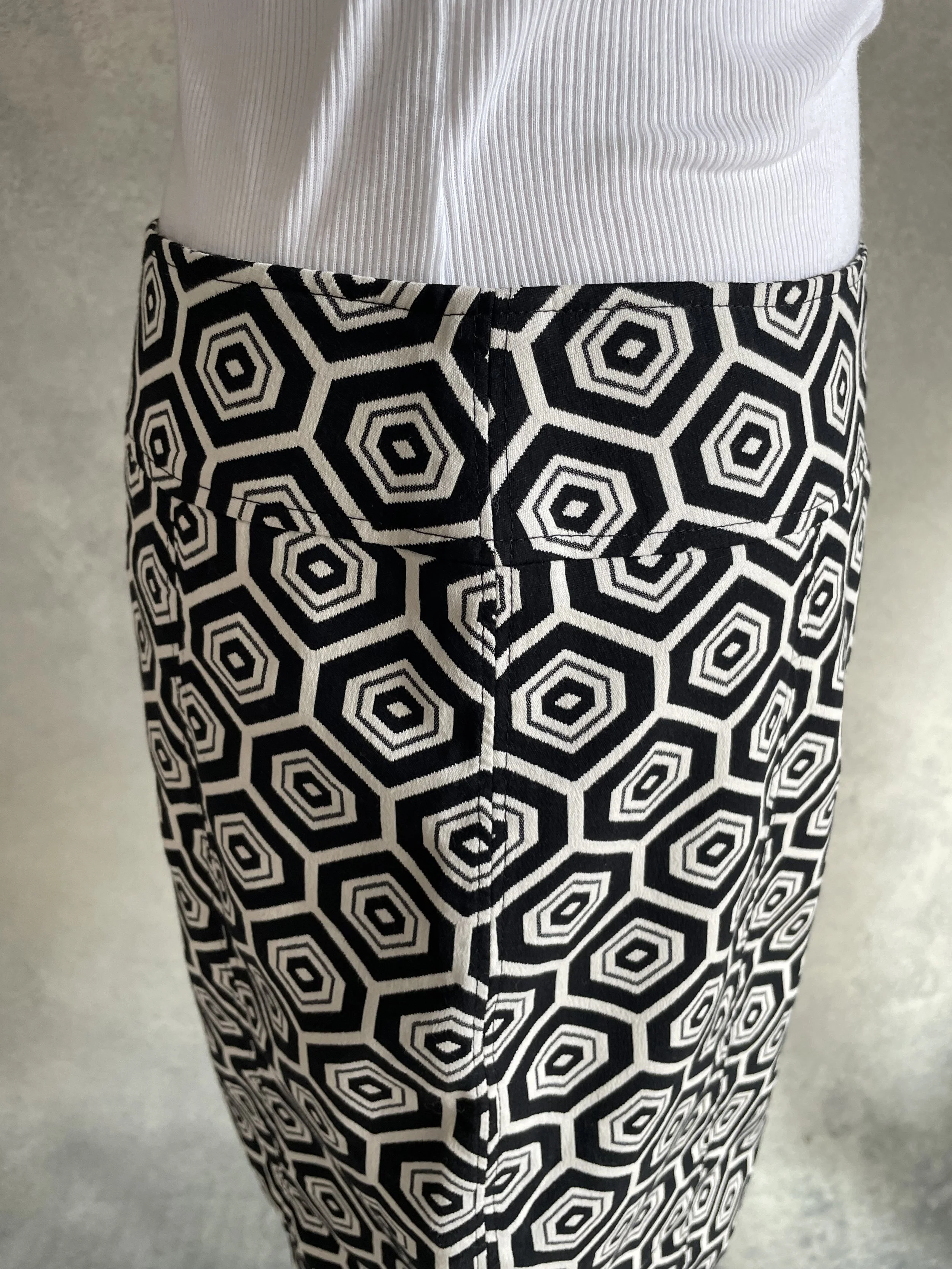 Detail shot of the black and white fabric and button hardware