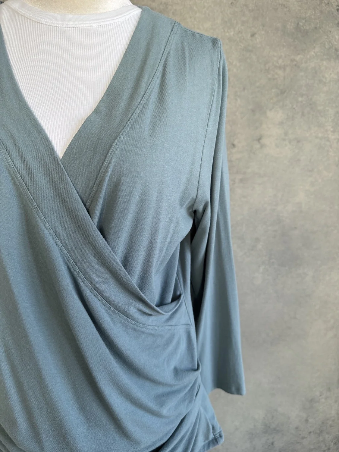 Ralph Lauren aqua blue wrap top V-neck overlap detail close-up
