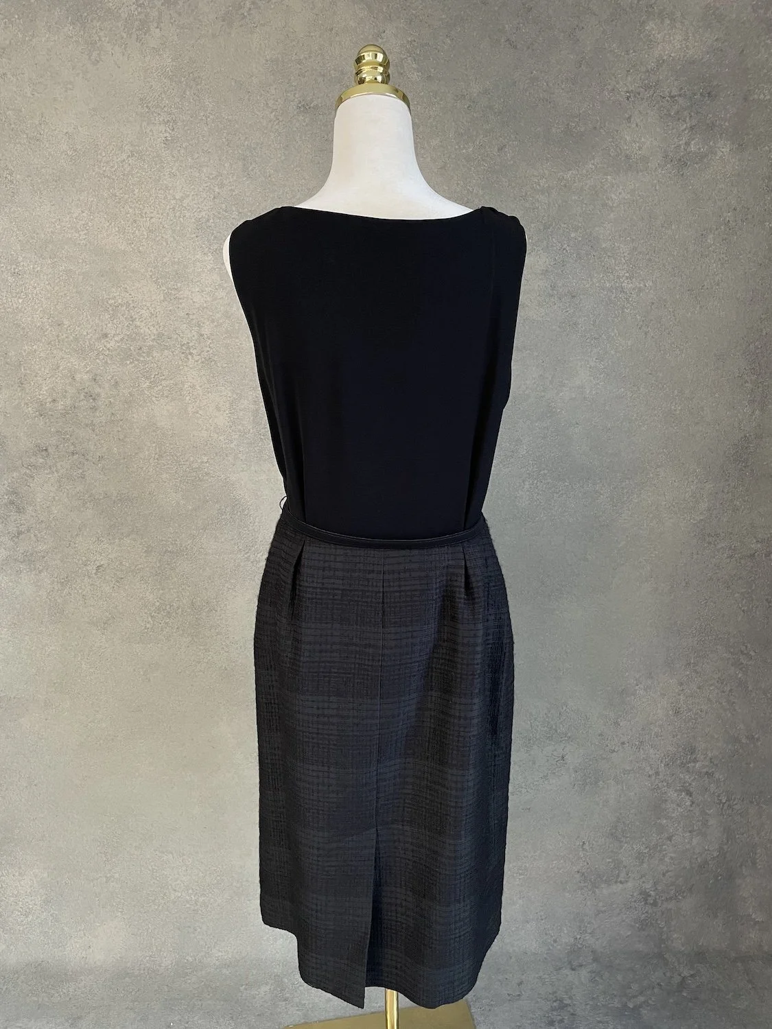 Rear view of the sheath dress, showing the center back slit and the fit of the skirt.