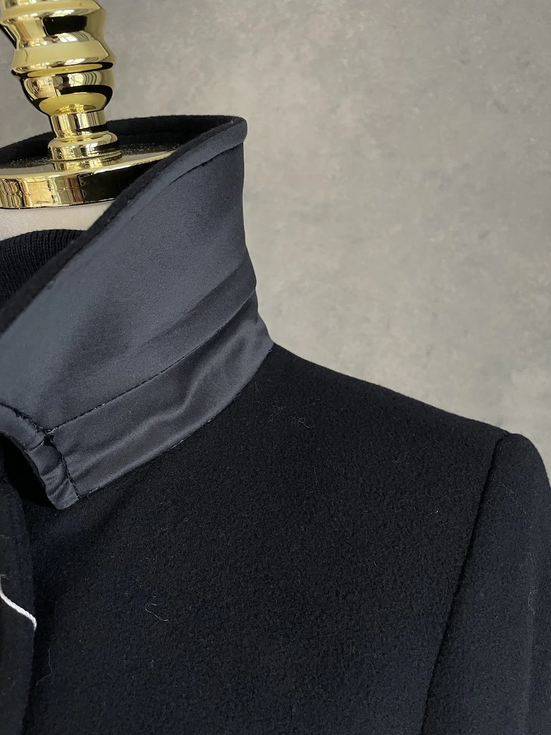 Scapa black coat collar detail showing satin trim