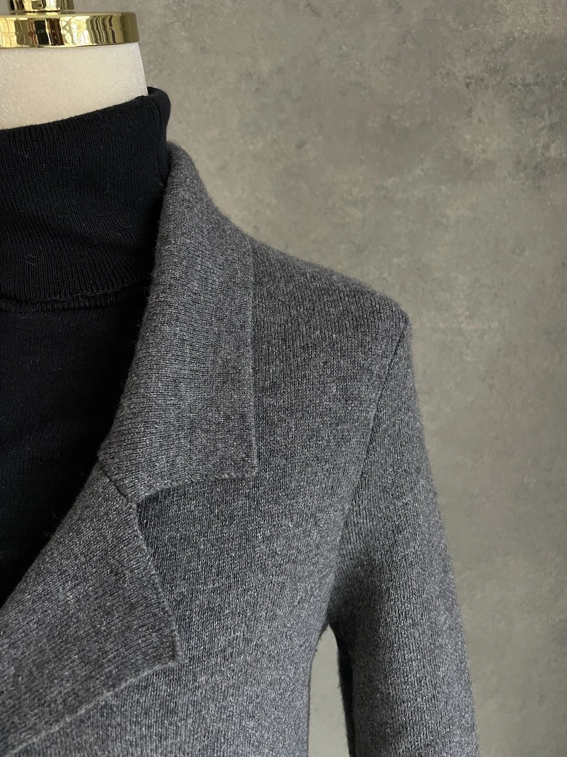 Close-up view of the lapel collar and shoulder structure of the NOTSHY cashmere cardigan