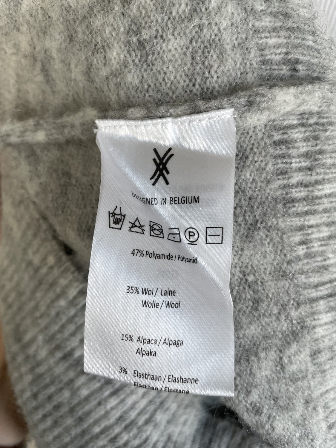Xandres composition label showing 47% polyamide 35% wool 15% alpaca 3% elastane