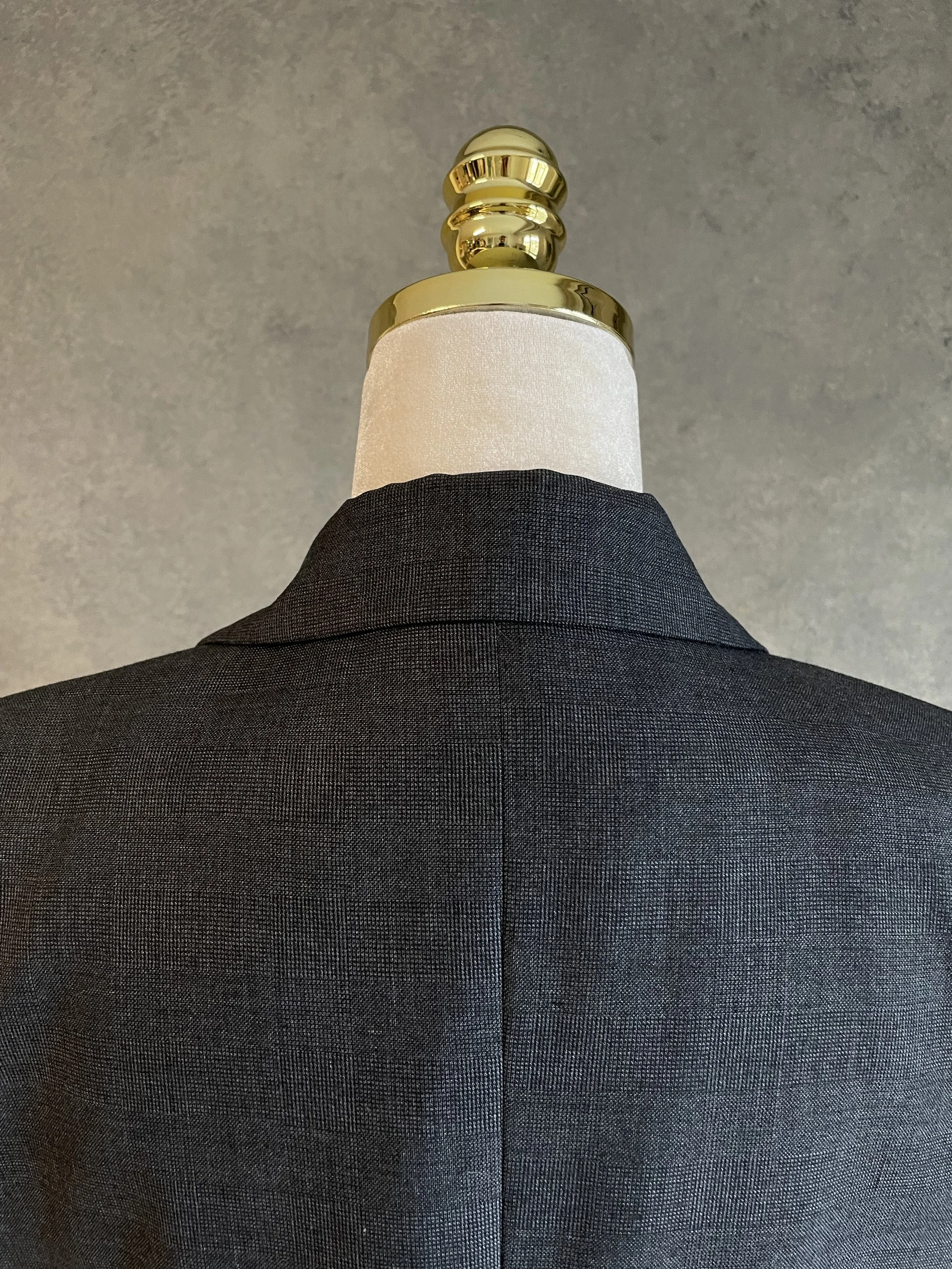 Close-up view of the back collar and shoulder seam construction.