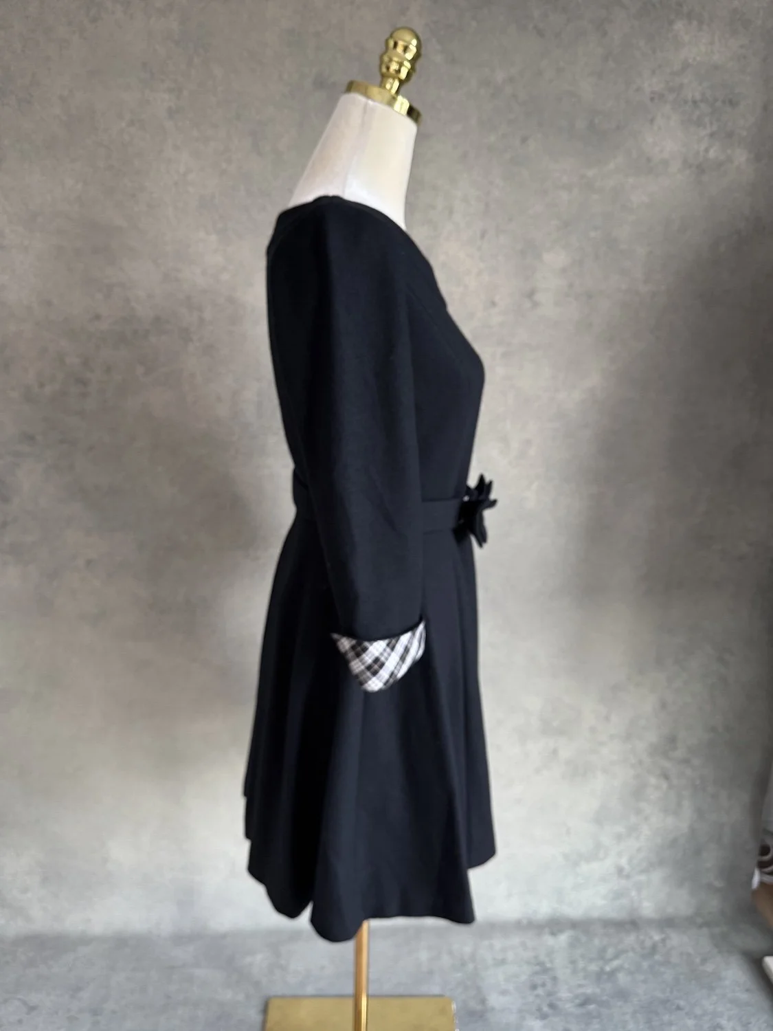 Side profile view of the dress on the mannequin.