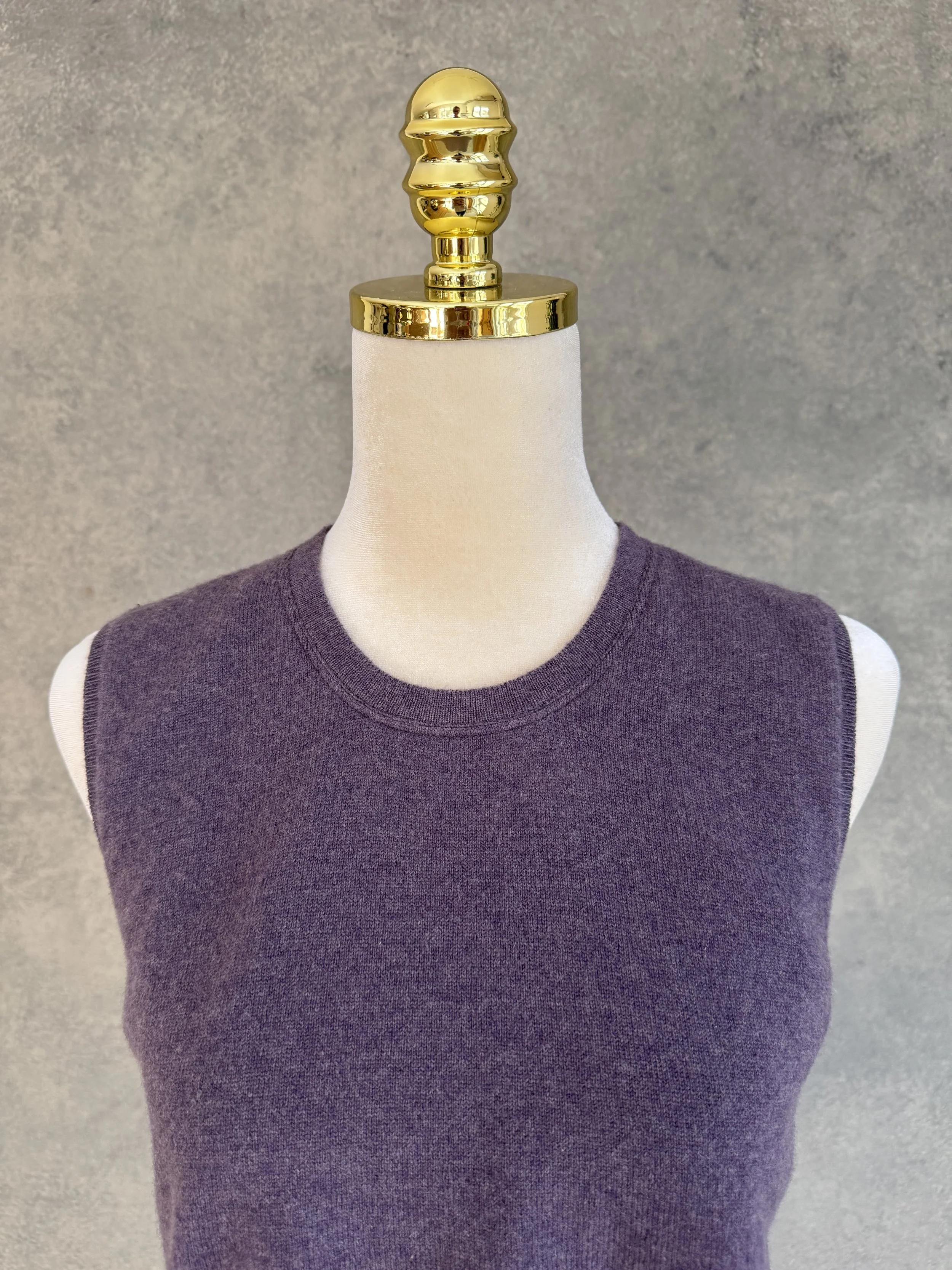 Close-up detail of the Brunello Cucinelli tunic neckline, highlighting the high-quality construction and delicate fabric sheen