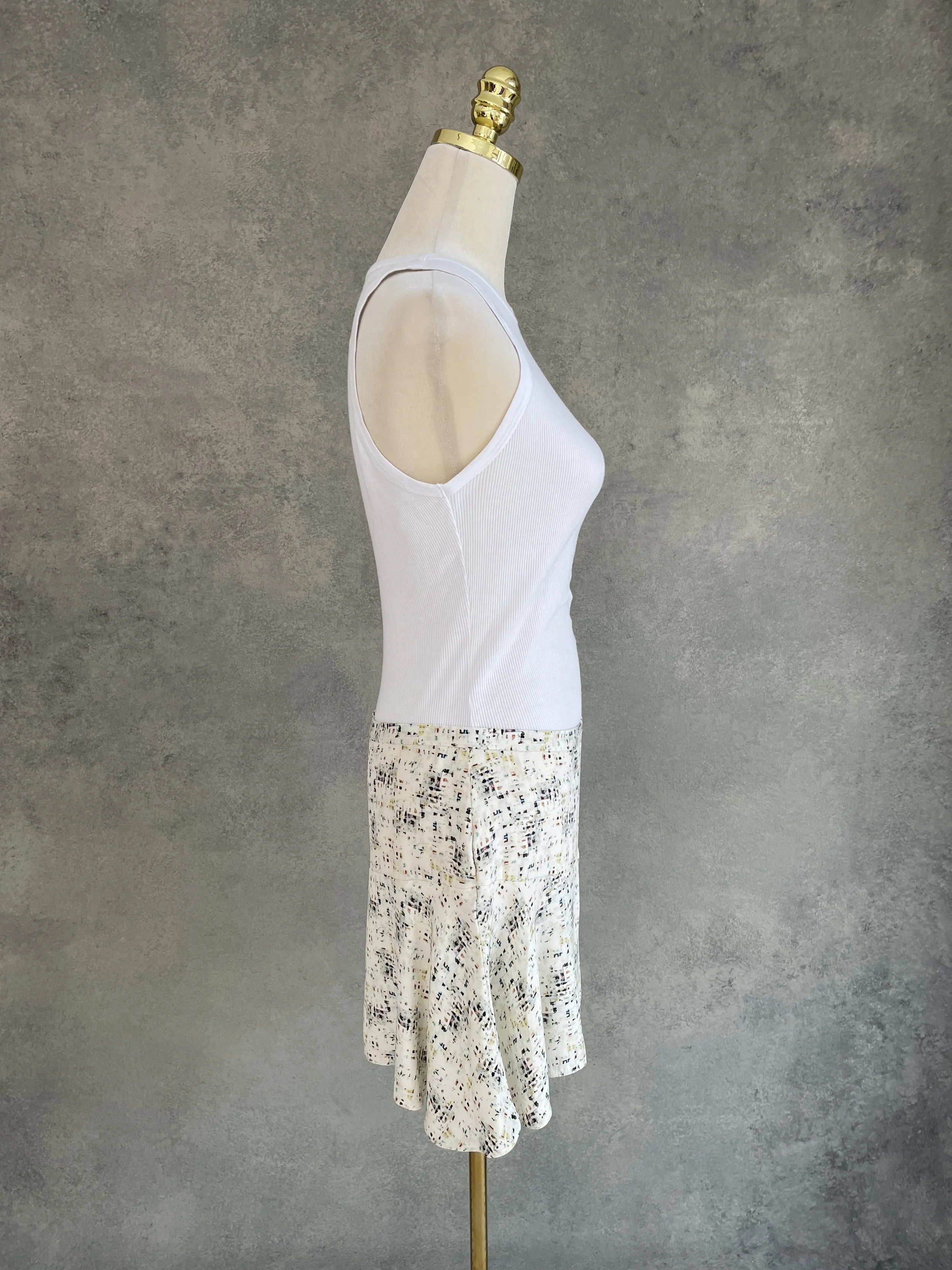Side view of a Joseph abstract print mini skirt showing the silhouette.