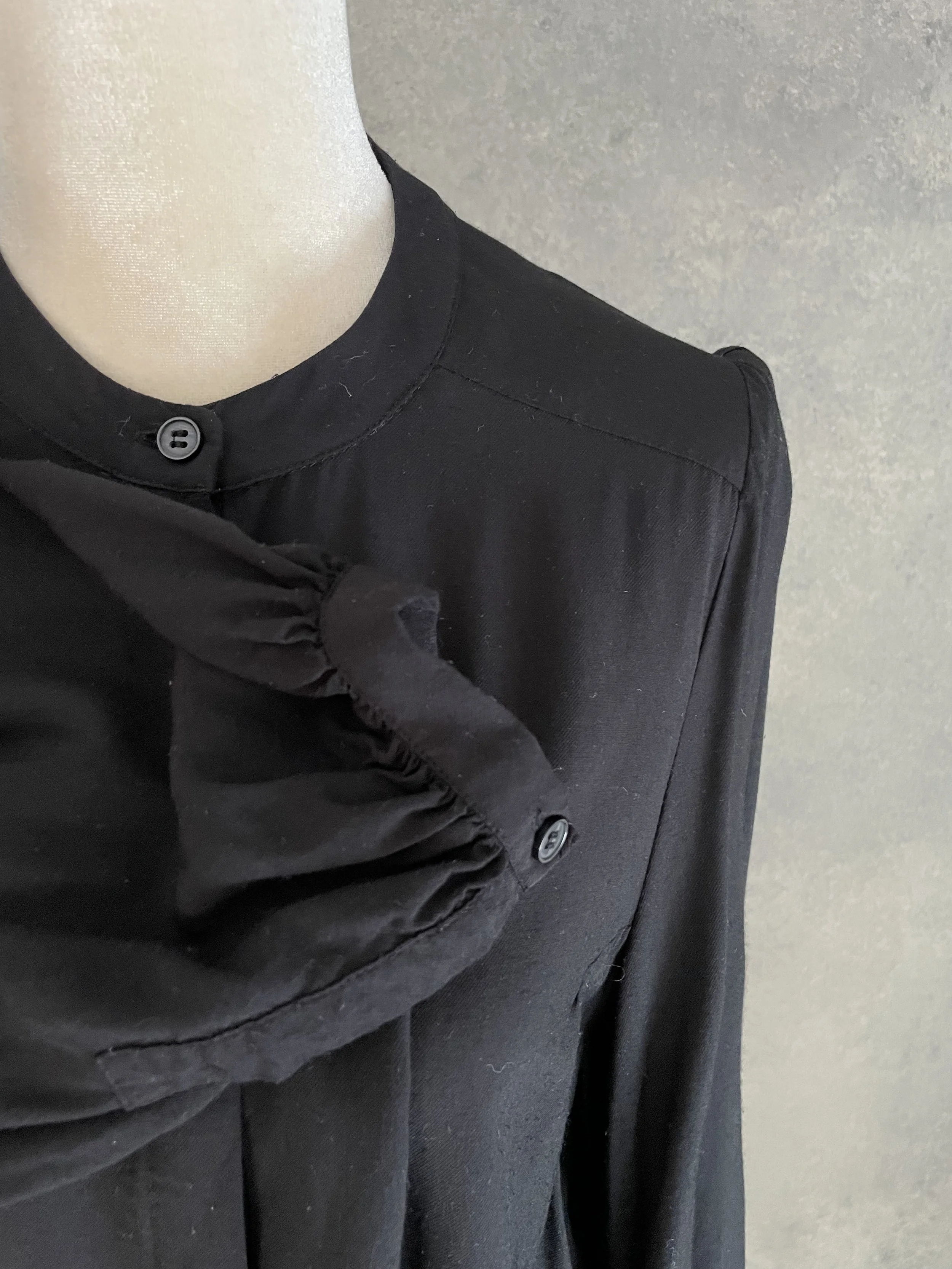 Detail shot showing the cuff and sleeve construction of the Rodebjer Lucy blouse.