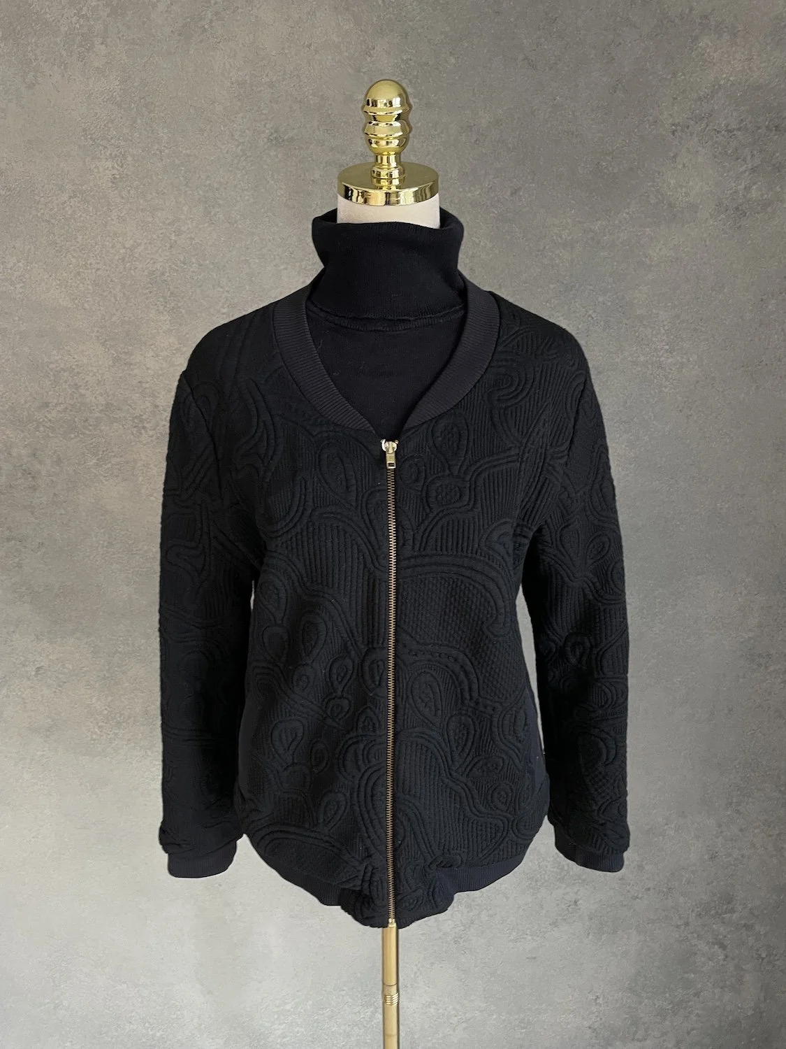Full front profile view showing the relaxed, voluminous bomber drop silhouette.