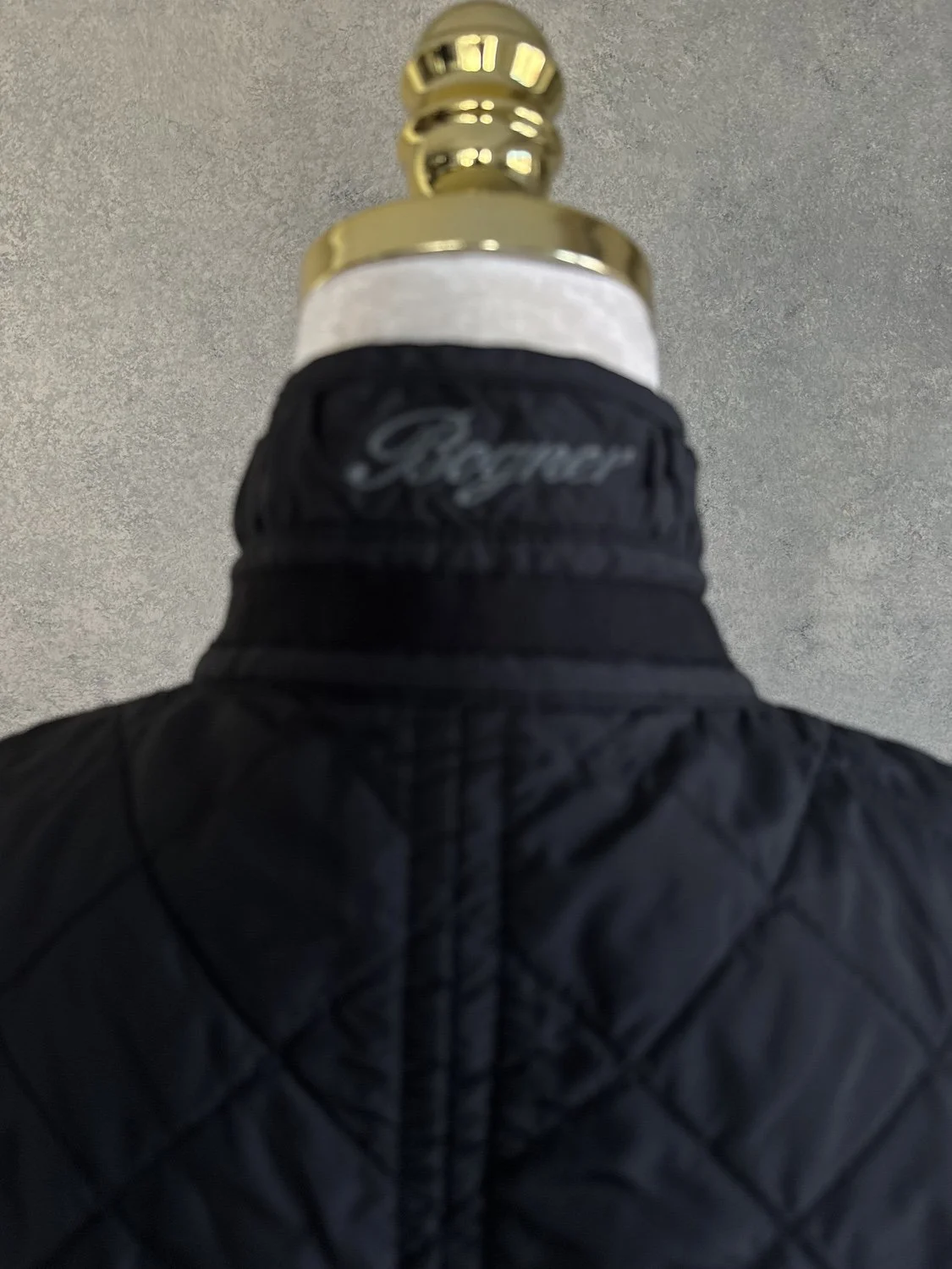Bogner embroidered logo detail on back of stand collar