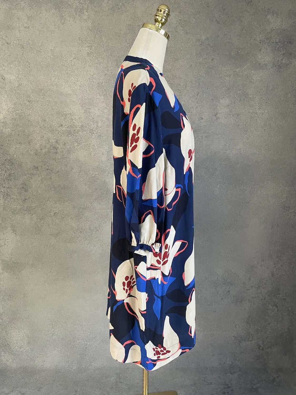 Nathalie Vleeschouwer floral midi dress profile view on mannequin