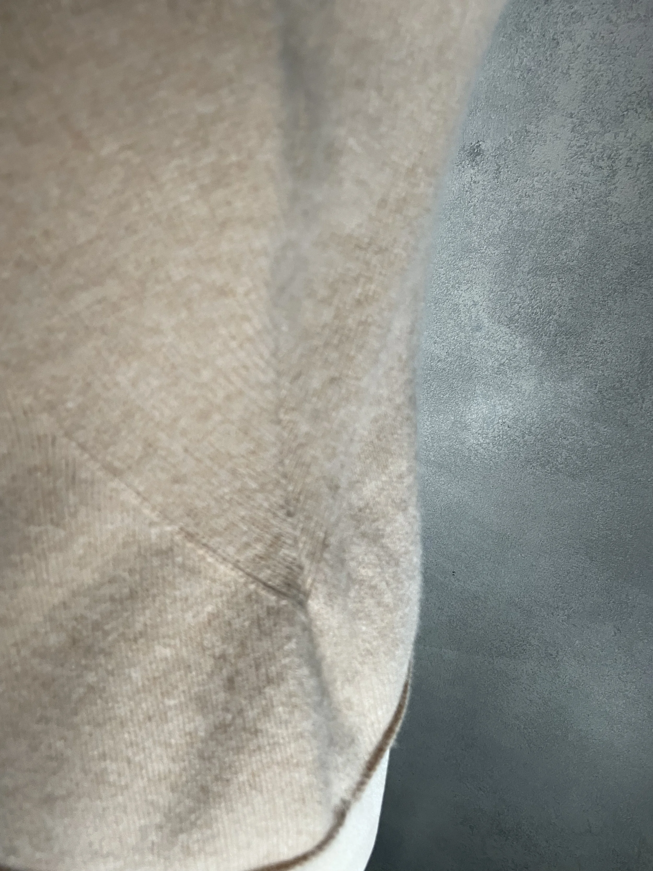 Close-up detail of the fabric construction and seam on the Iris von Arnim cashmere tank top."
