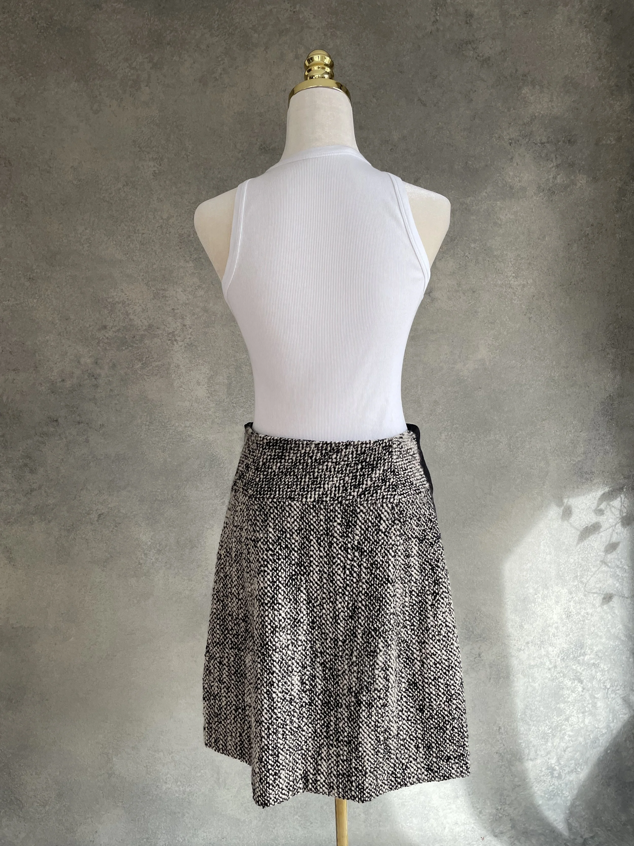 Back view of the Natan wool blend skirt, straight elegant lines.