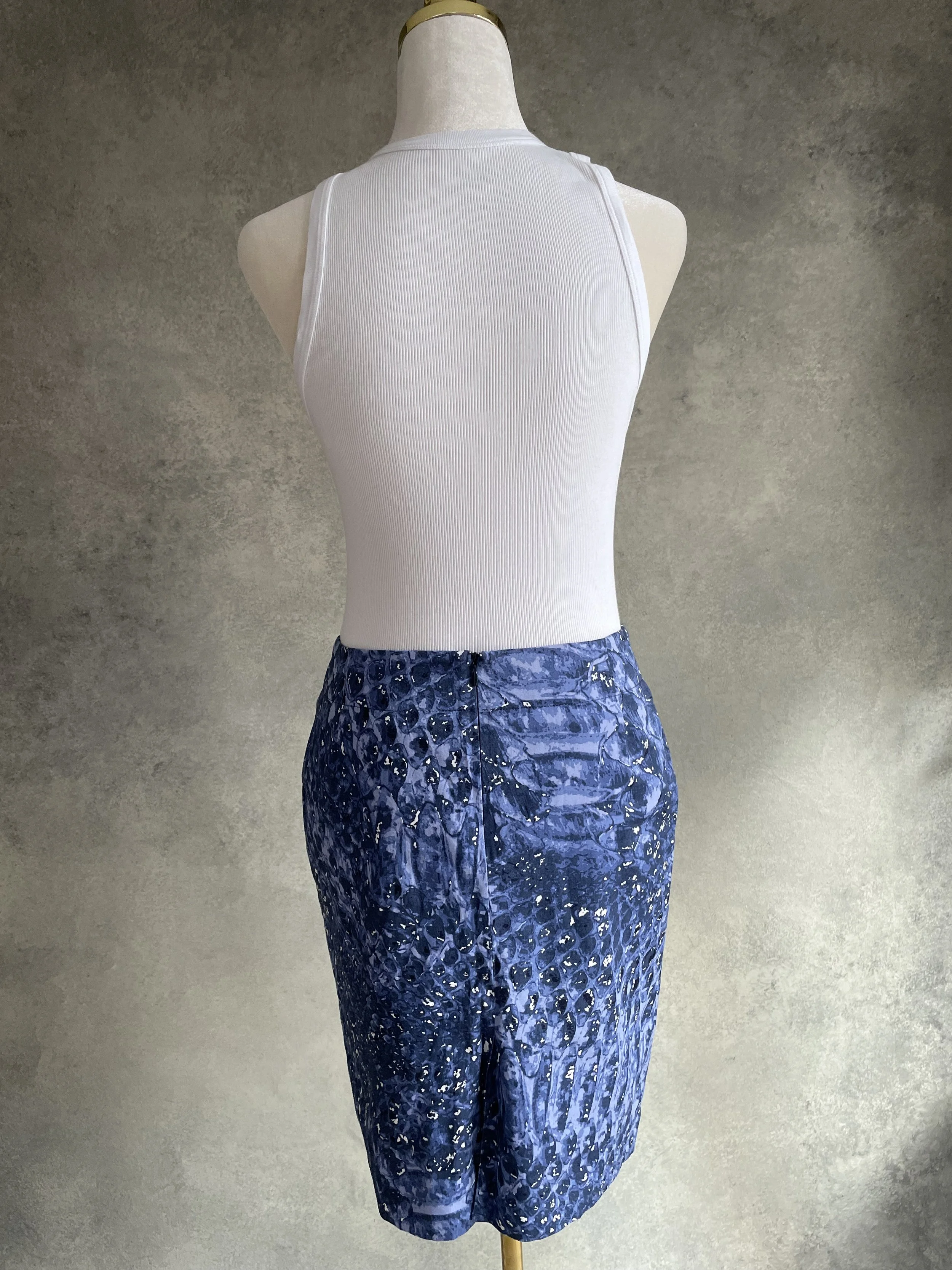 Back view of Gigue midi skirt with graphic design.