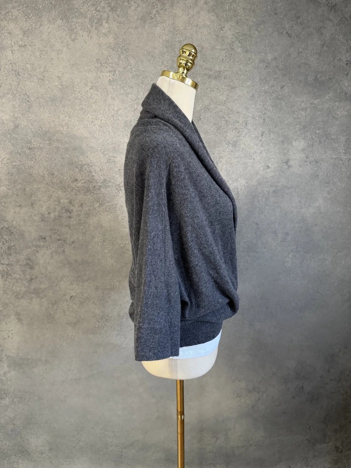 Side profile view of Hoss Intropia dark grey wrap-style knit pullover