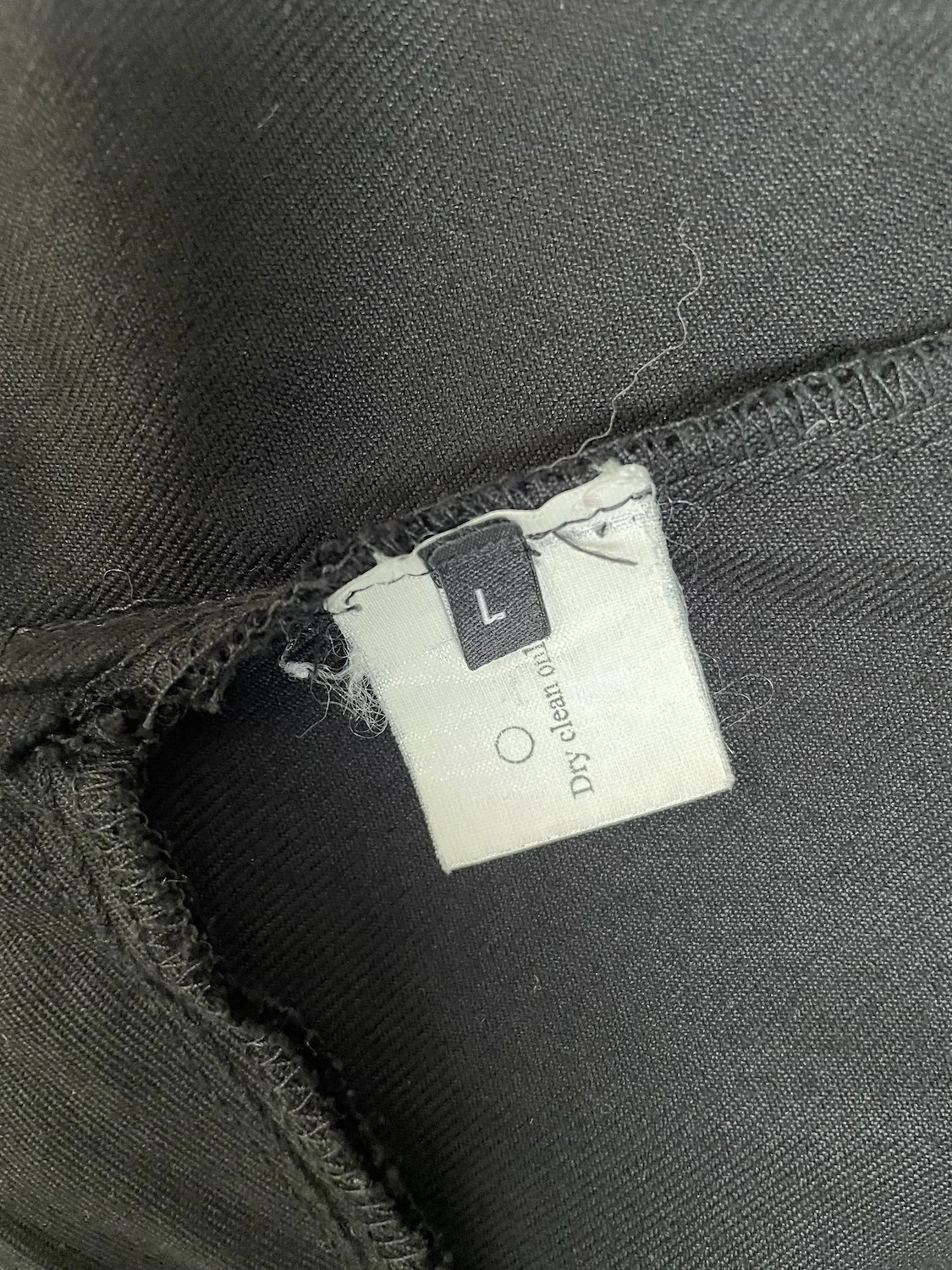 Rodebjer interior care and size tag showing size L