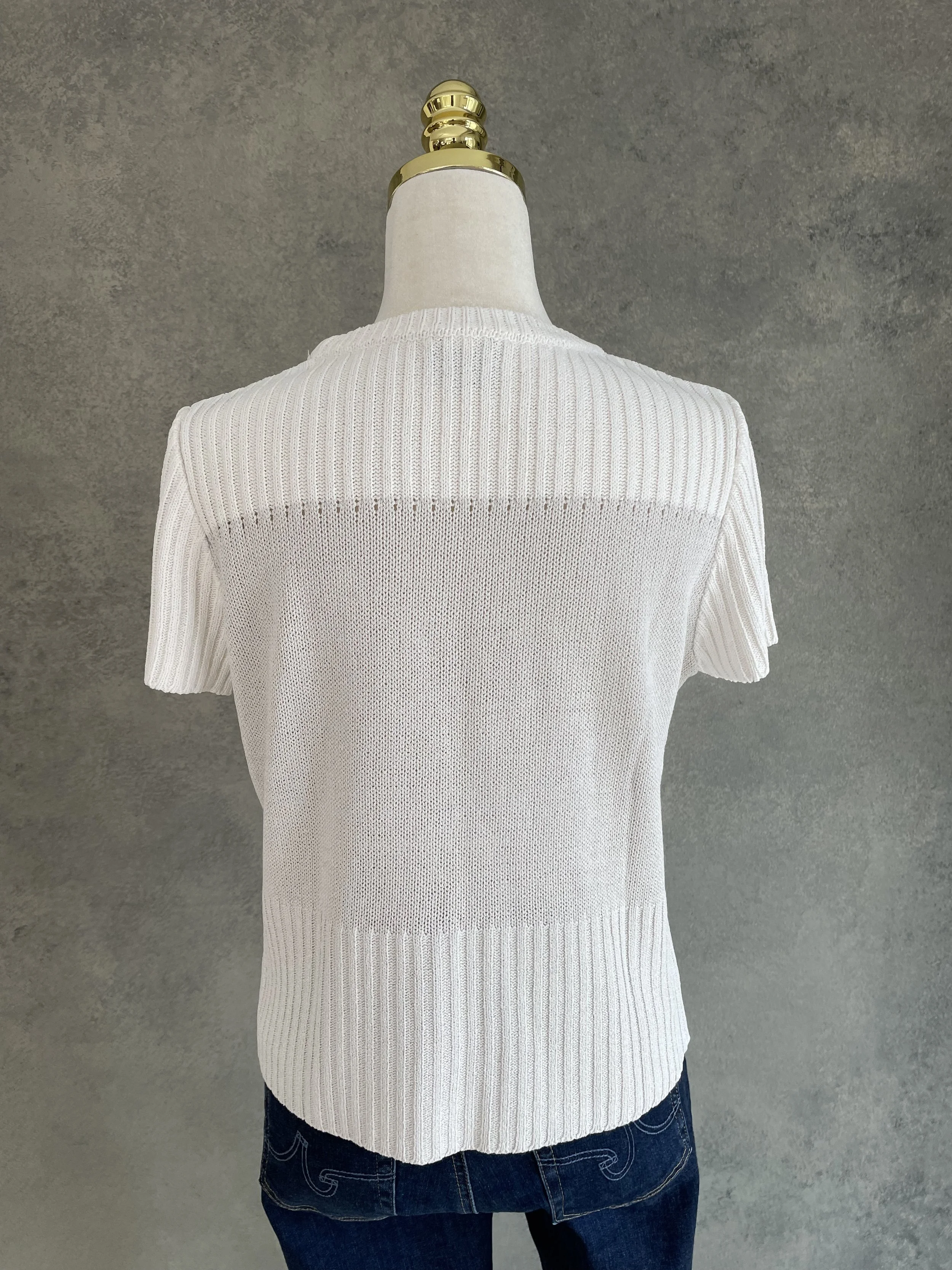 Rear view of the Natan top showing the contrast between the central knit panel and ribbed trim.