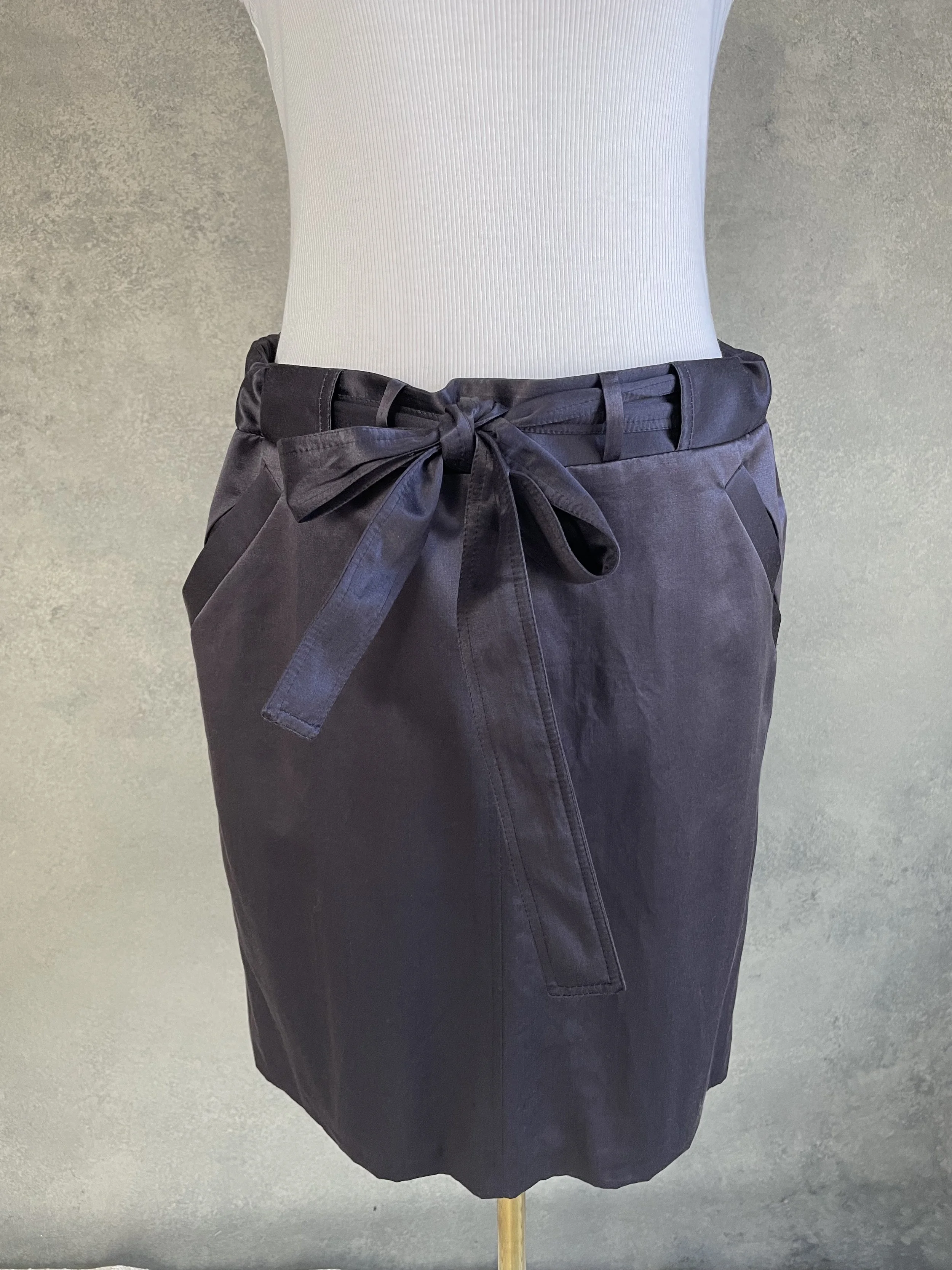 Close-up detail shot of the fabric texture and stitching of the Presque Fini skirt.