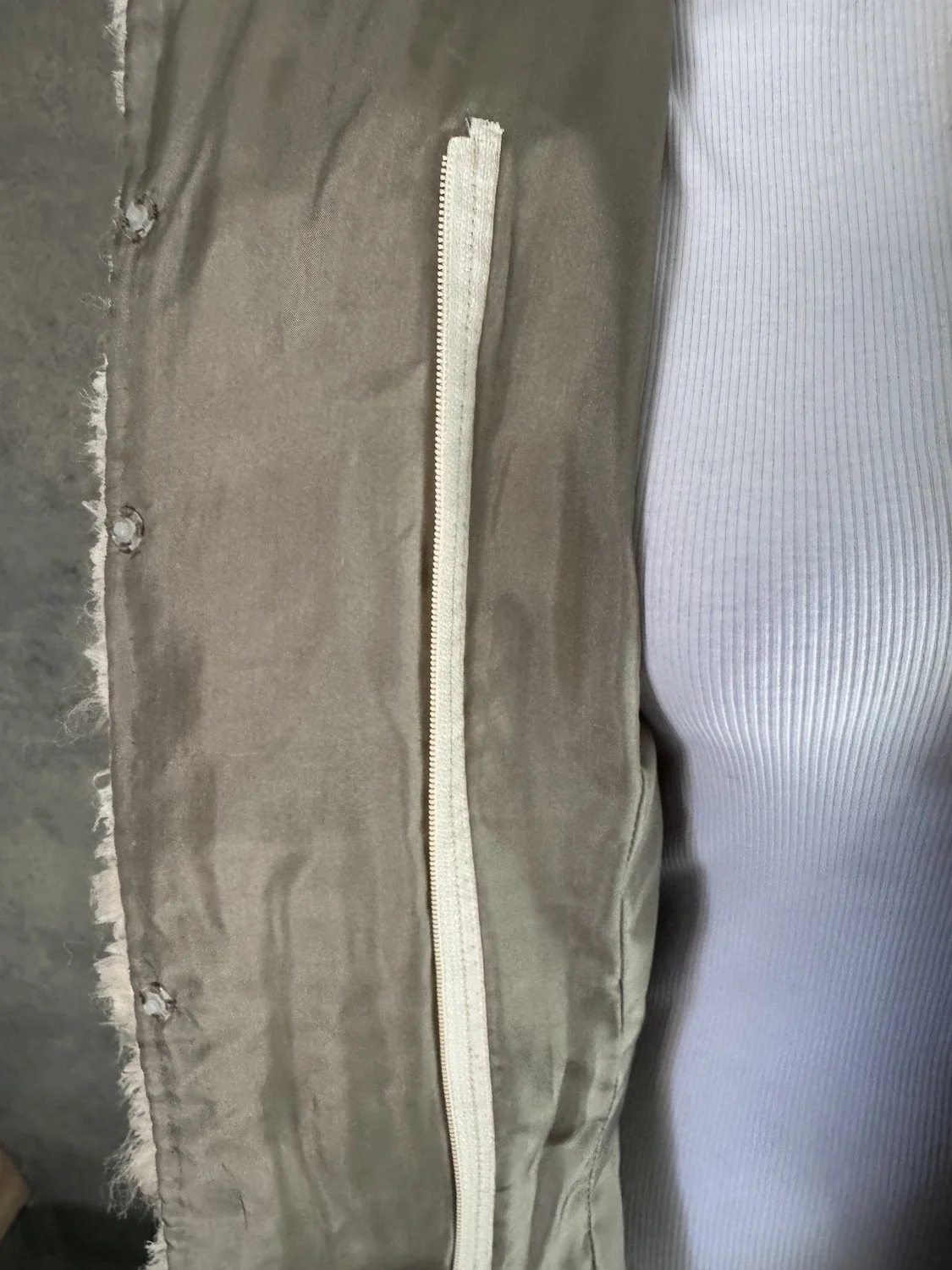 Interior silk lining and zipper detail of Jantaminiau designer blazer
