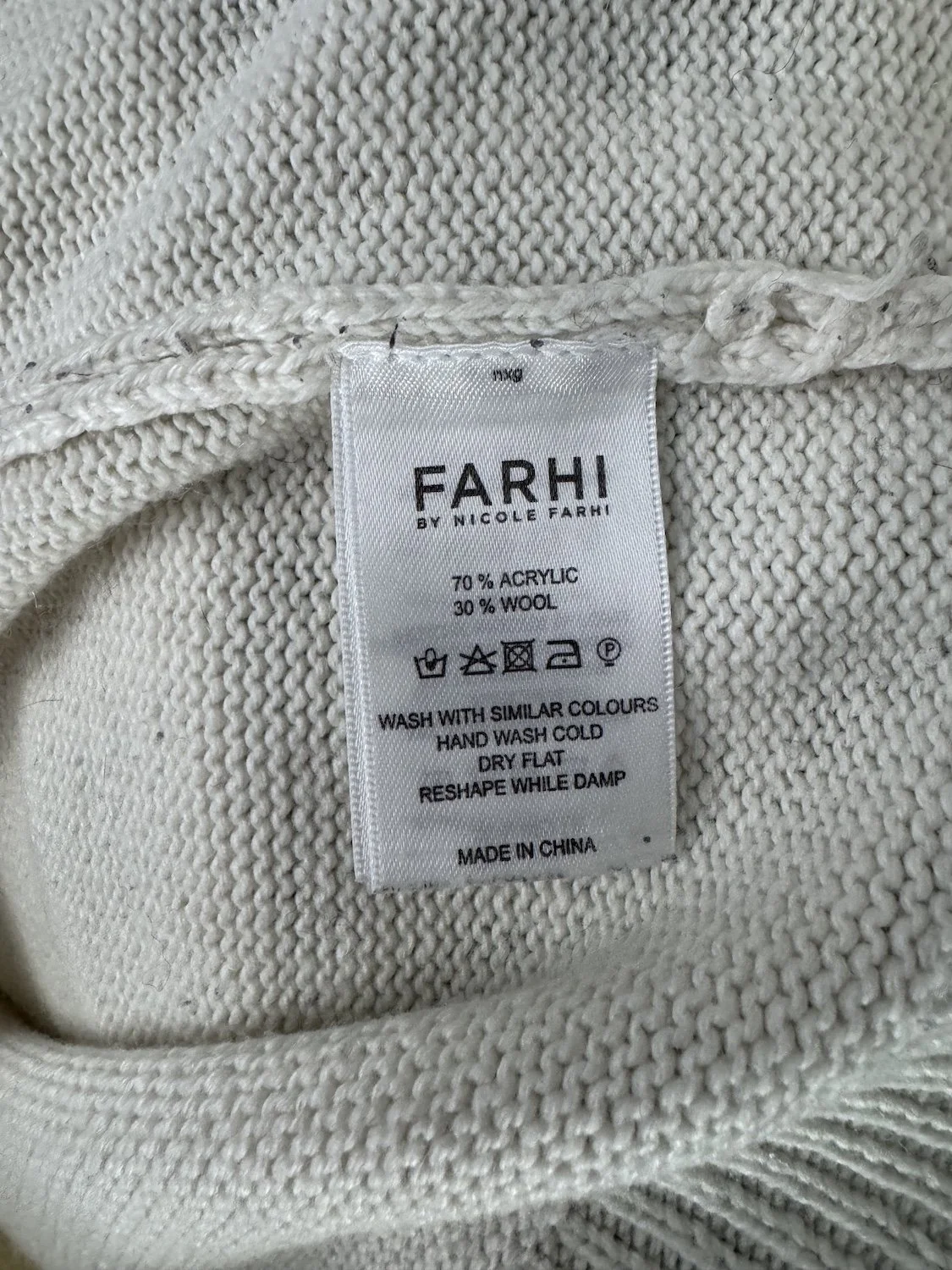 Farhi by Nicole Farhi material and care composition tag showing 70% acrylic 30% wool hand wash instructions