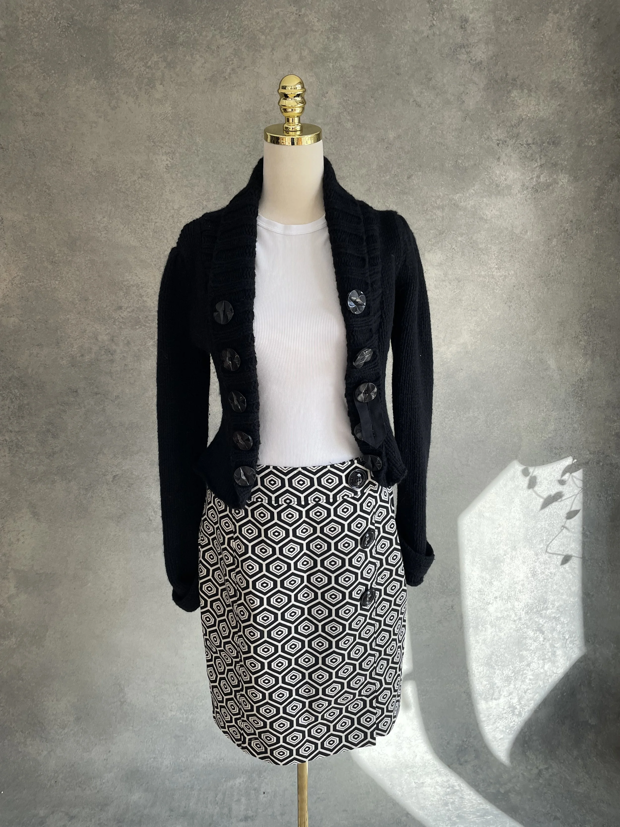 Full length view of the black and white skirt styled on a mannequin.