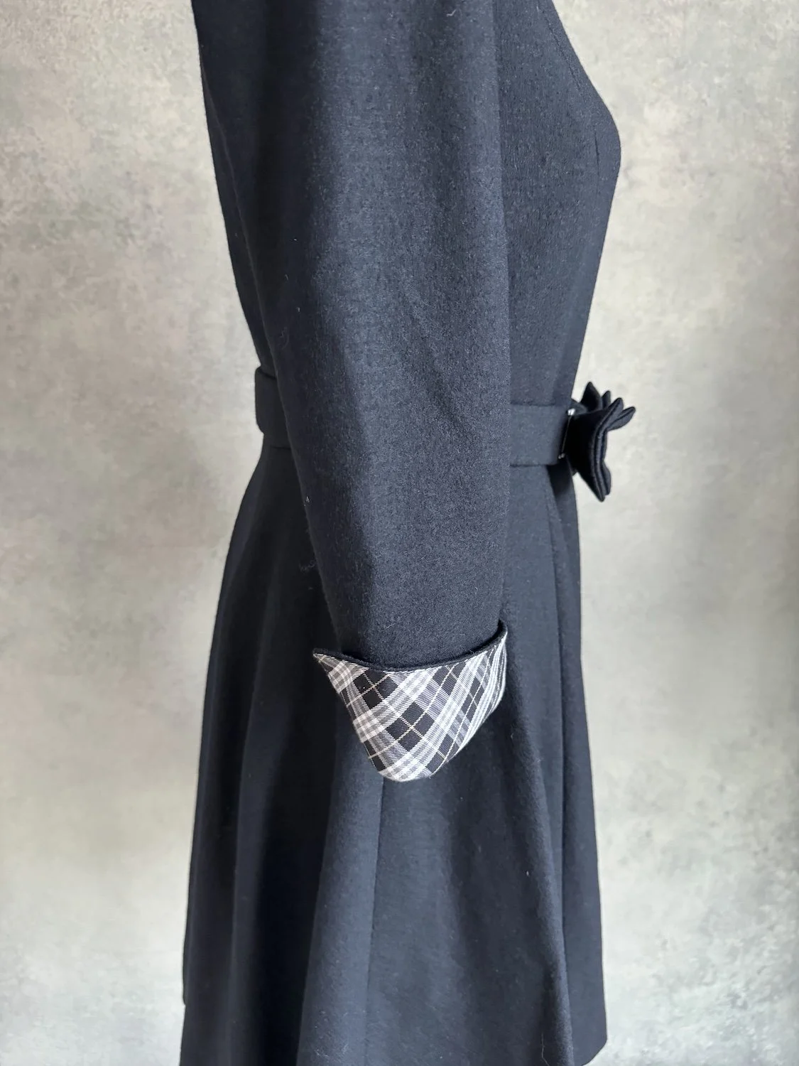 Side view of the sleeve showing the folded classic check pattern cuff.