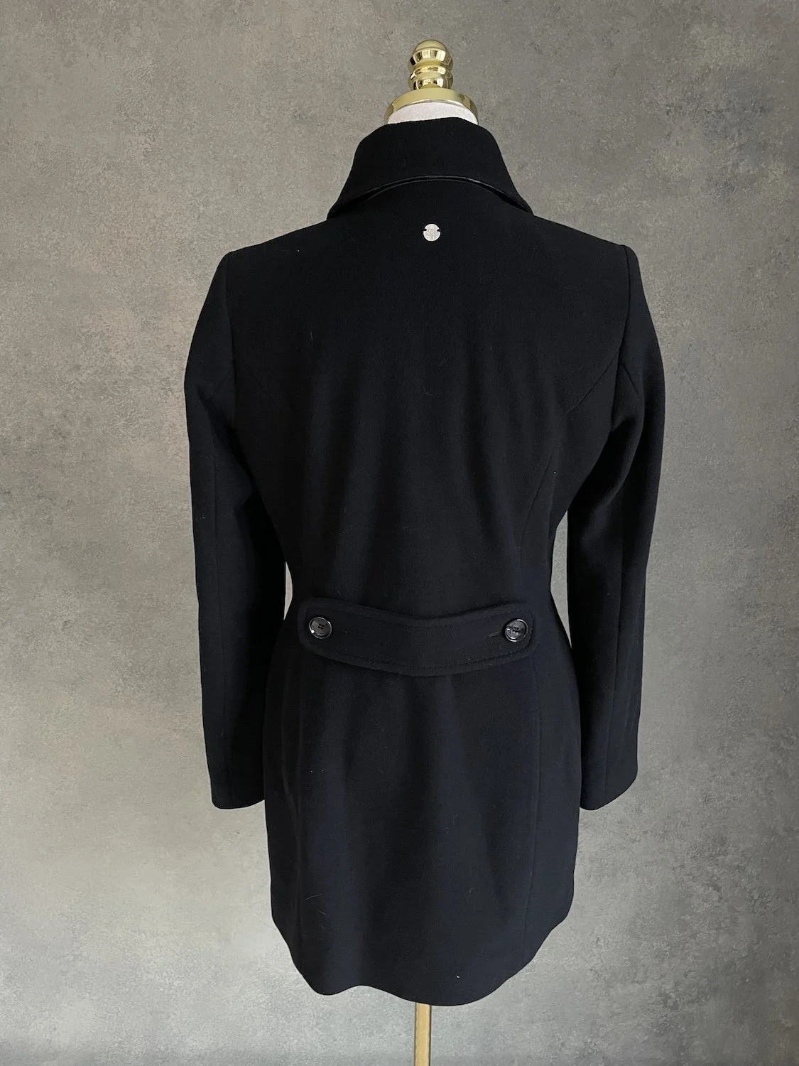 Scapa black coat back view showing waist tab detail