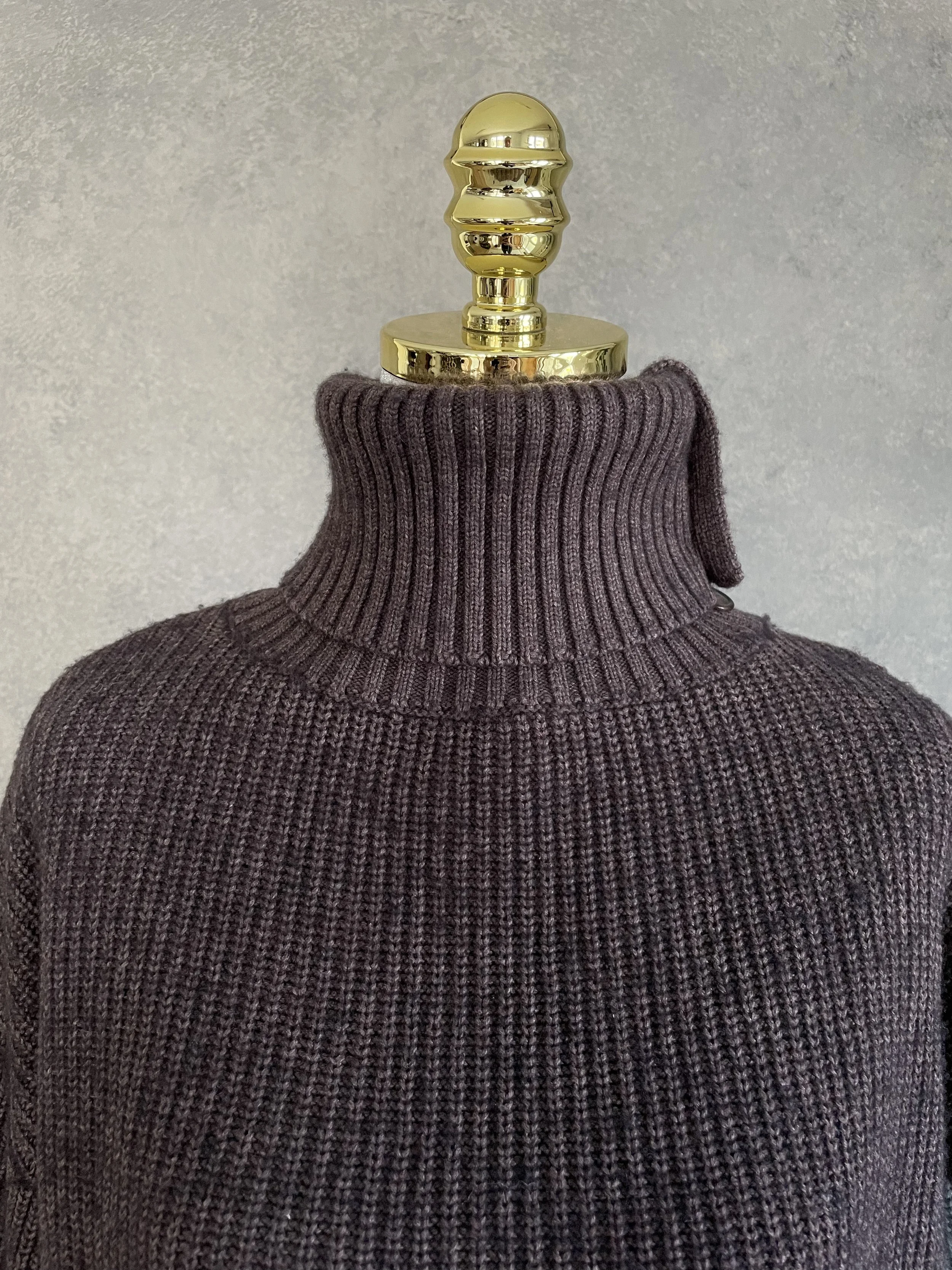 Close-up view of the ribbed dark brown polo neckline and button detailing on a Blanche sweater.