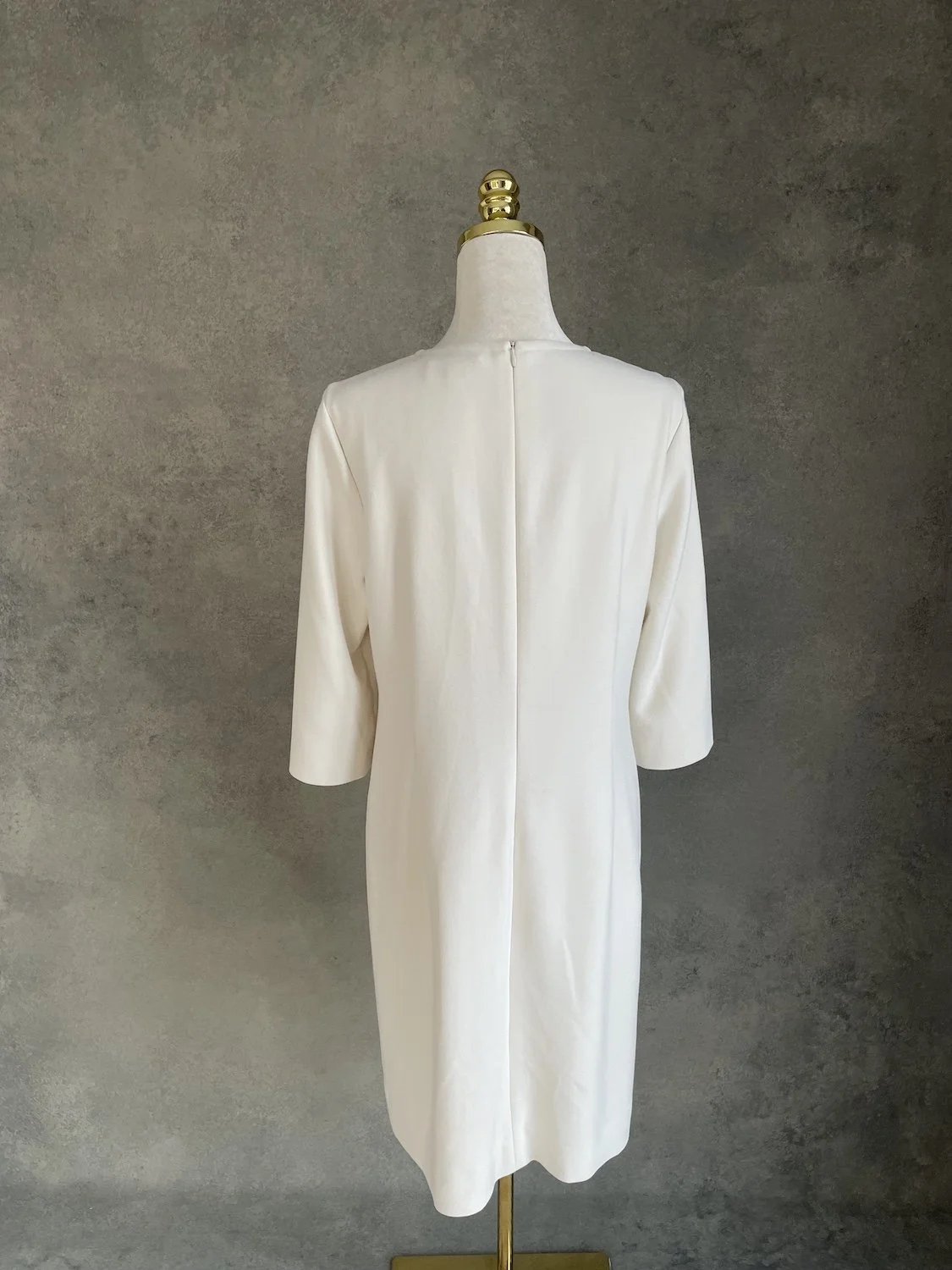 Gigue off-white dress back view on mannequin